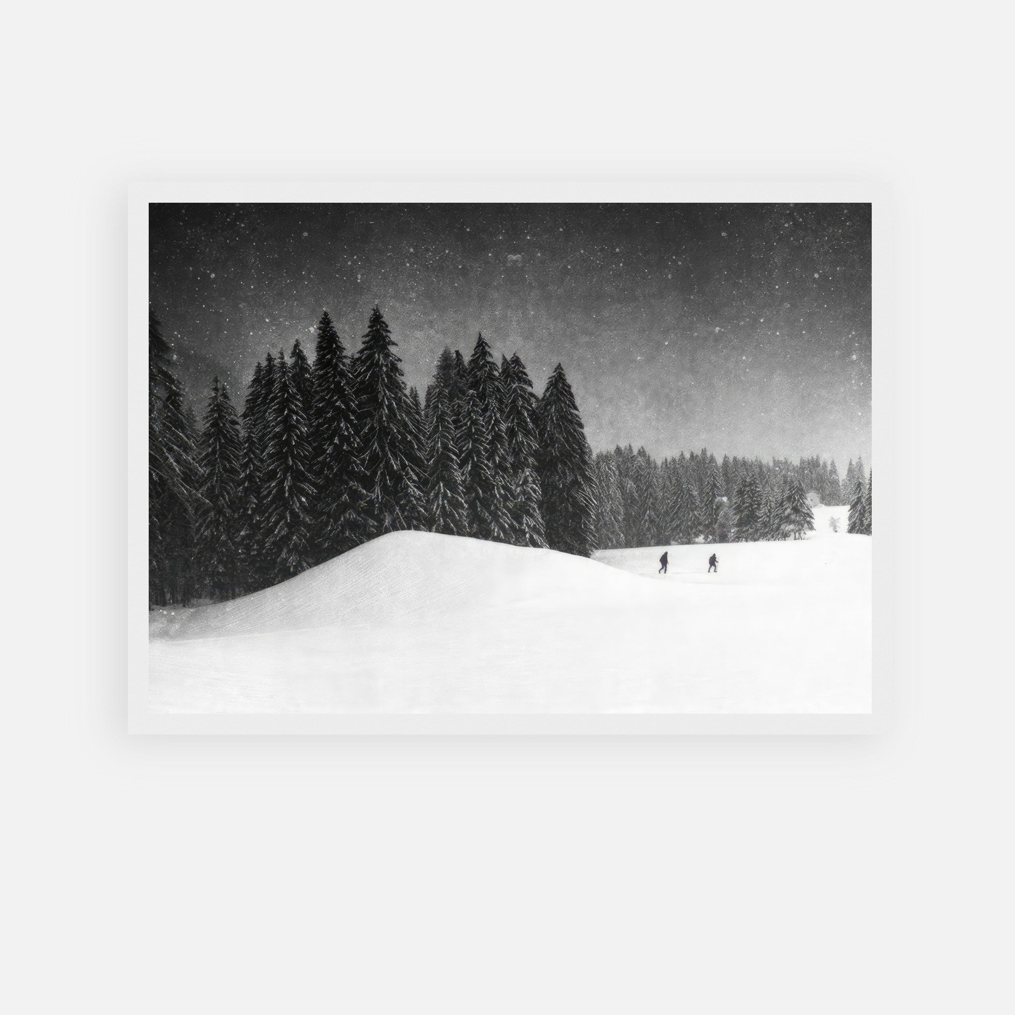 Winter Crossing framed print depicting skiers in a snowy forest landscape with tall evergreens.