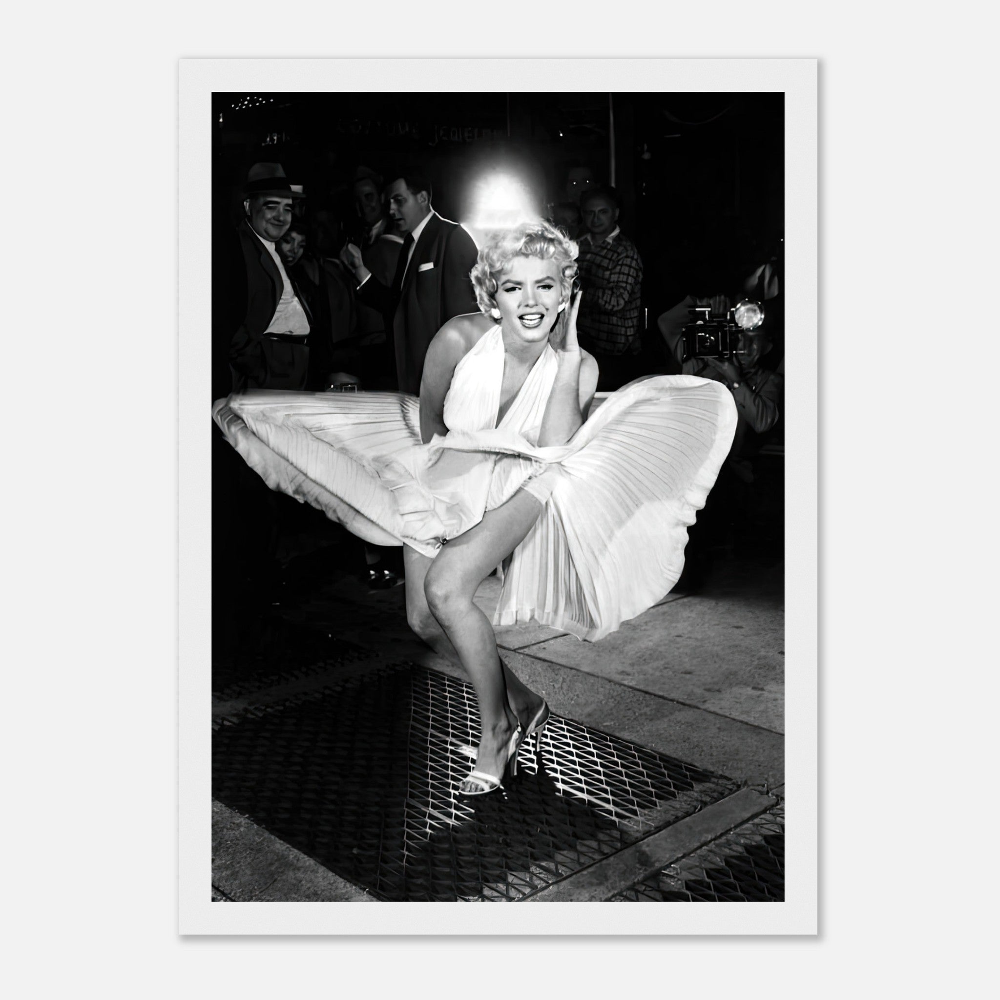 Marilyn Monroe in iconic wind-blown photograph, wearing white dress standing over subway grate, framed print.