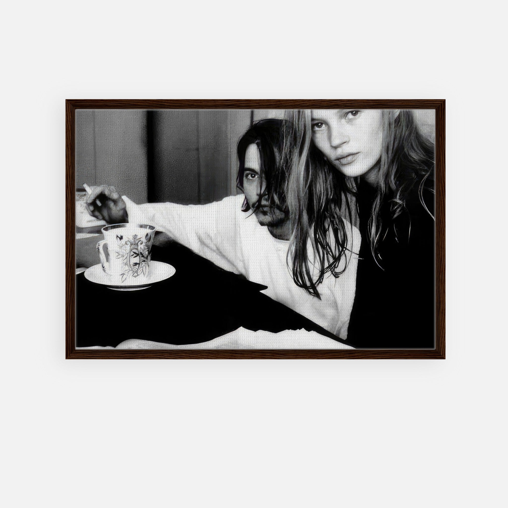 Framed black-and-white canvas print of Johnny Depp and Kate Moss capturing 1990s celebrity romance.