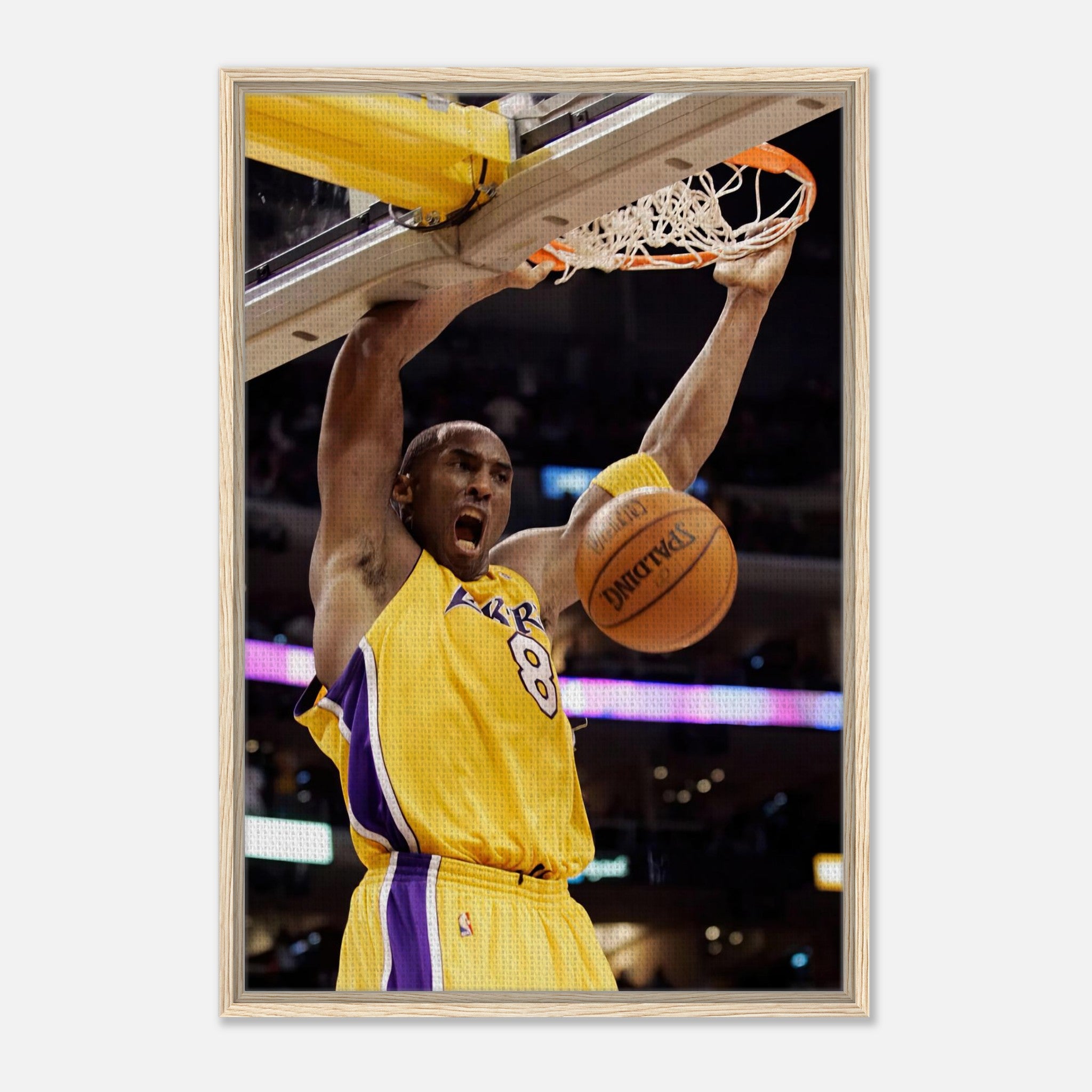 Kobe Bryant's iconic slam dunk framed canvas print showcasing his powerful mid-air shot.