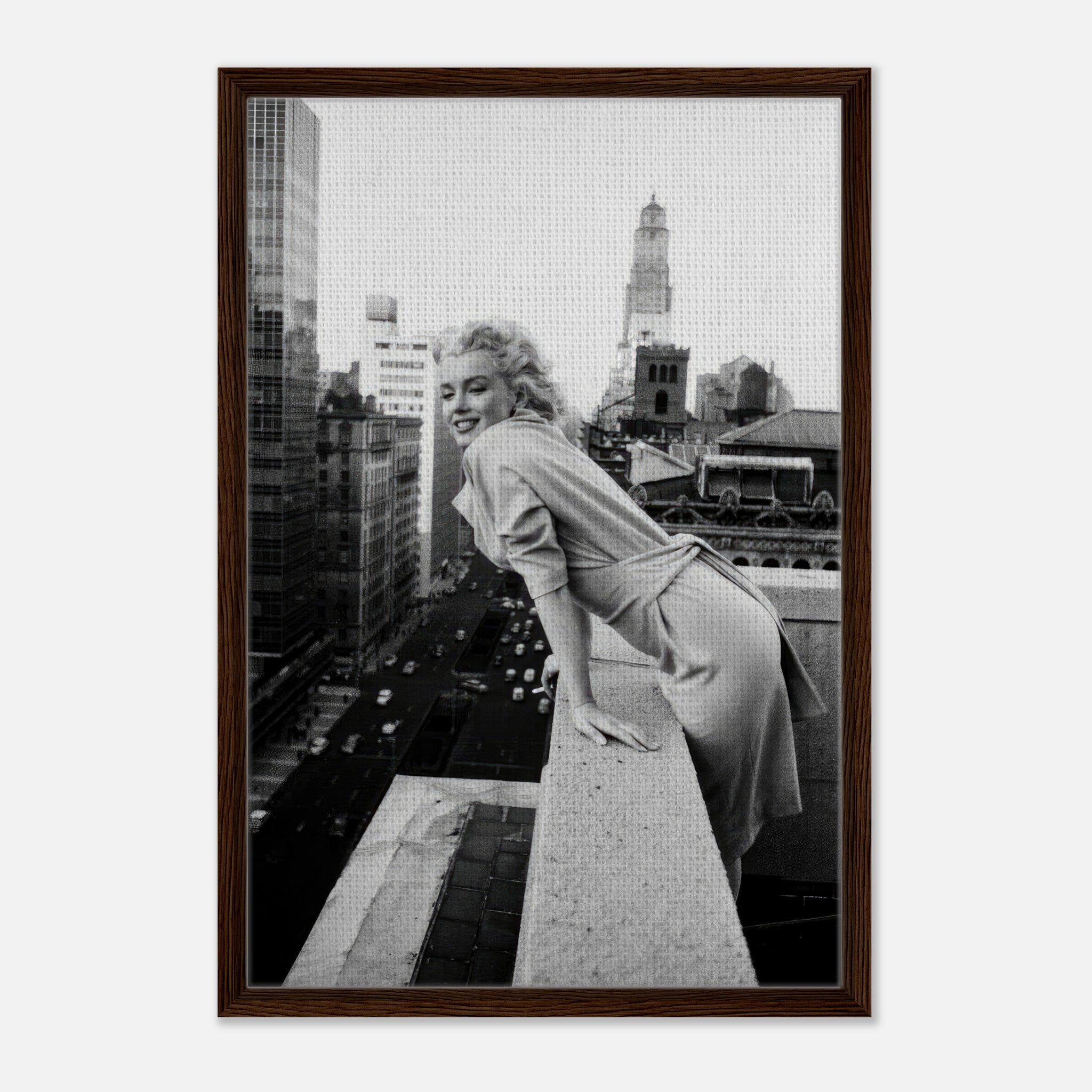 Marilyn Monroe smiling on a rooftop overlooking New York City in a black-and-white framed canvas.