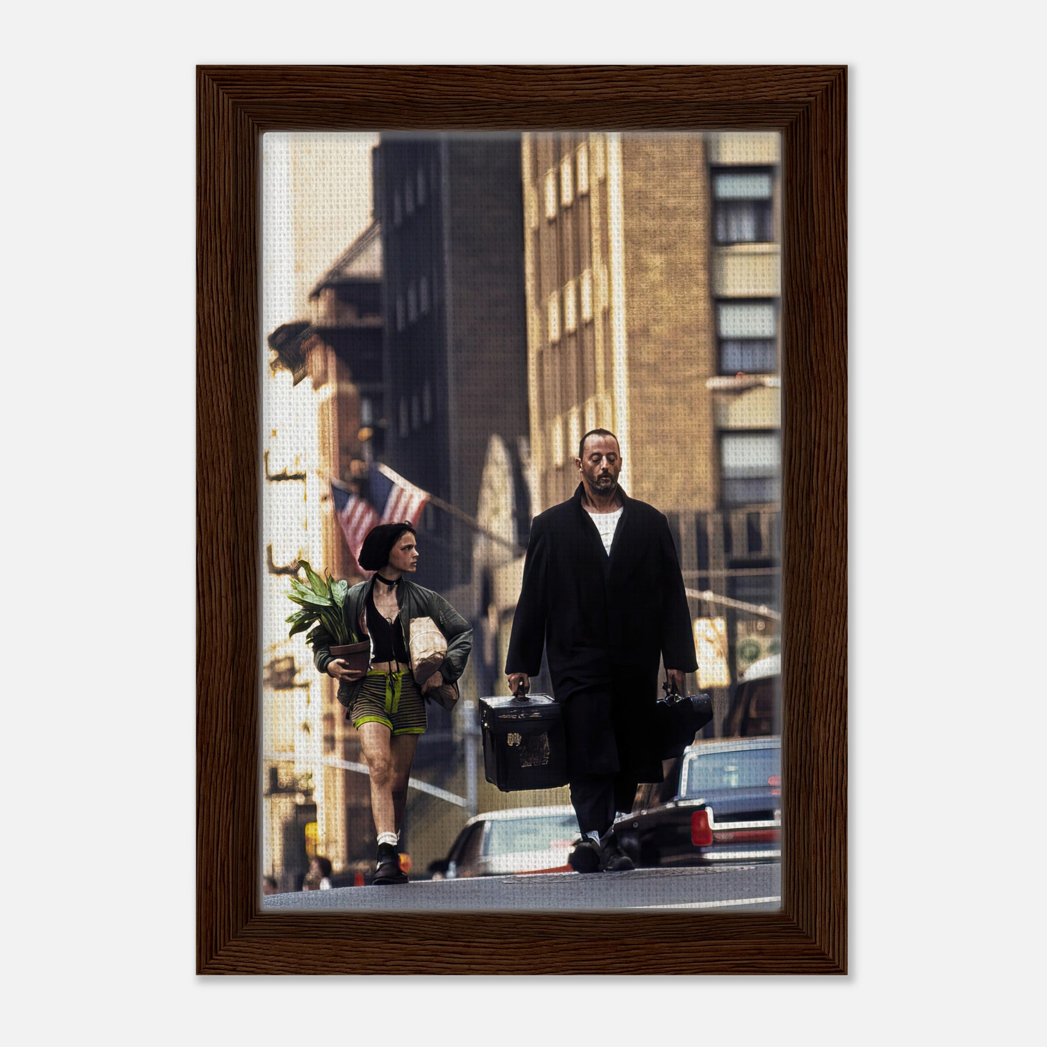 Framed canvas print of Jean Reno and Natalie Portman in Leon walking together in a city scene.
