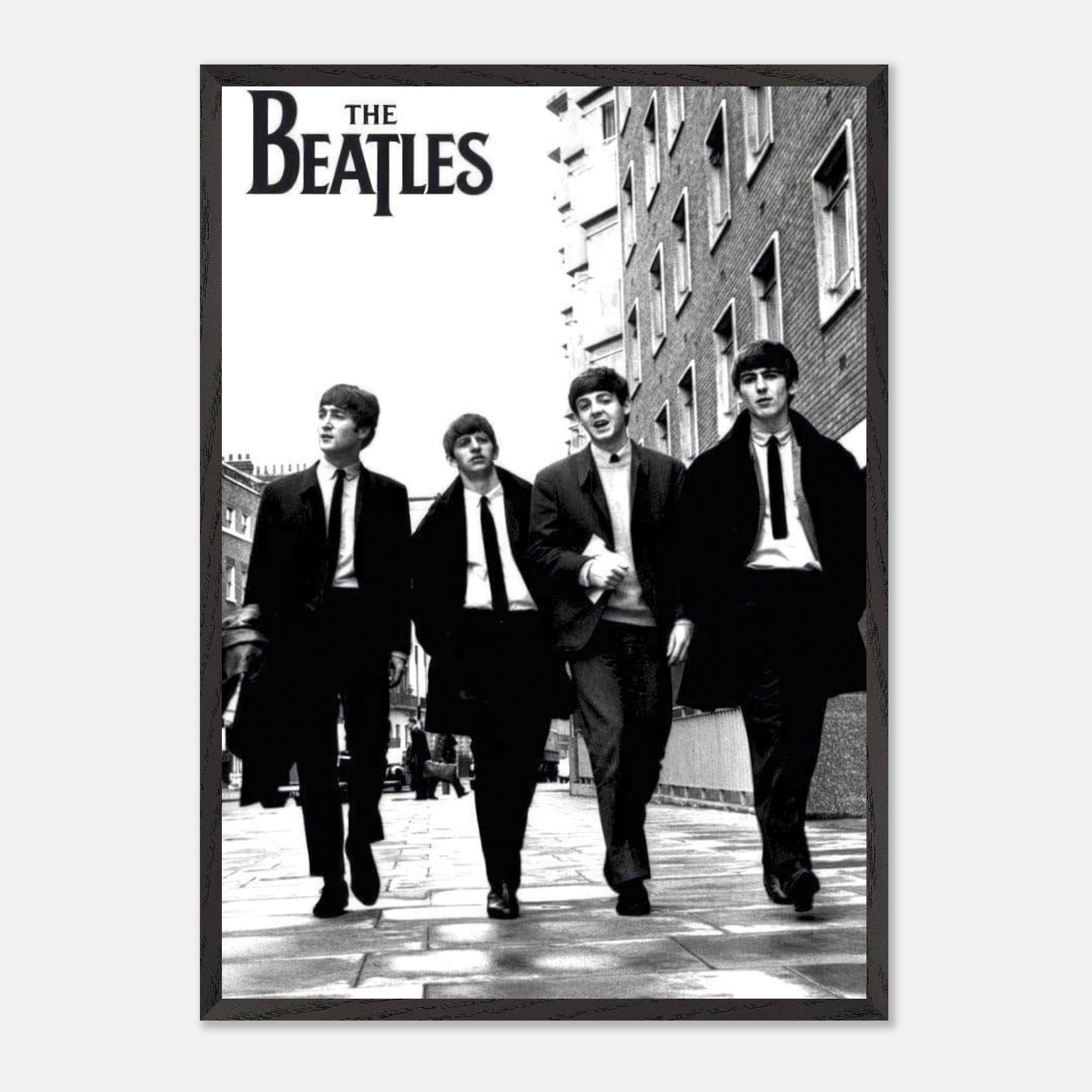 The Beatles Cover vintage framed print featuring the iconic band walking in black and white on a city street.