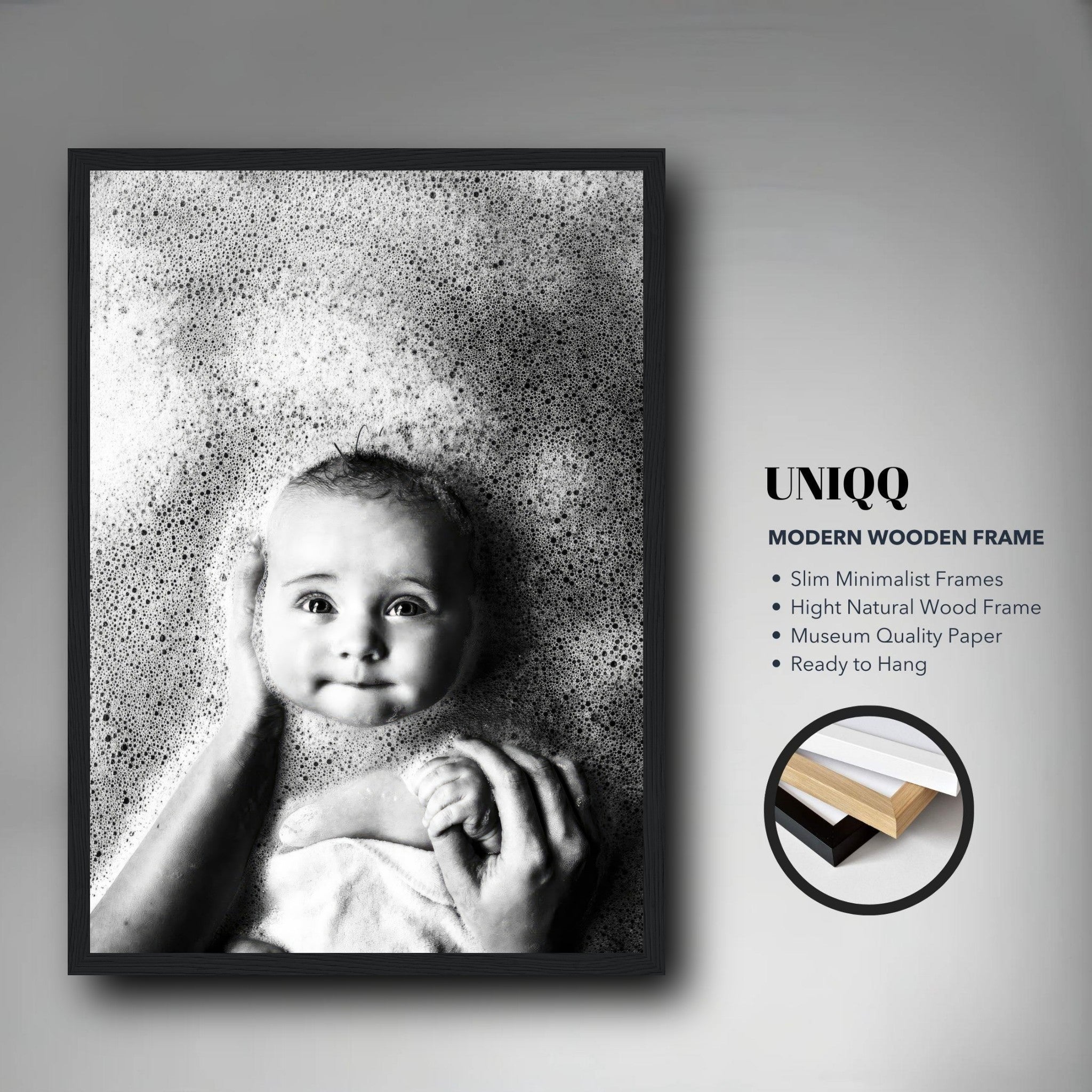 Baby bath photography framed print showcasing a joyful baby surrounded by bubbles in a sleek wooden frame.