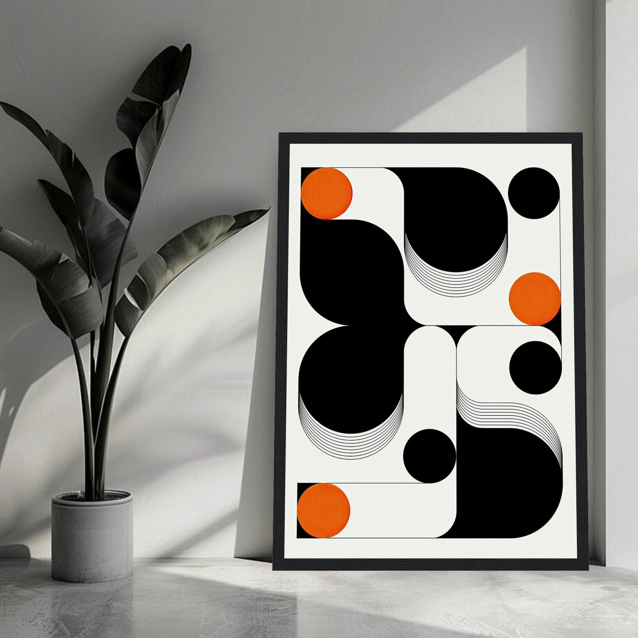 Modern geometric abstract art print with black, white, and orange elements in a stylish interior setting.