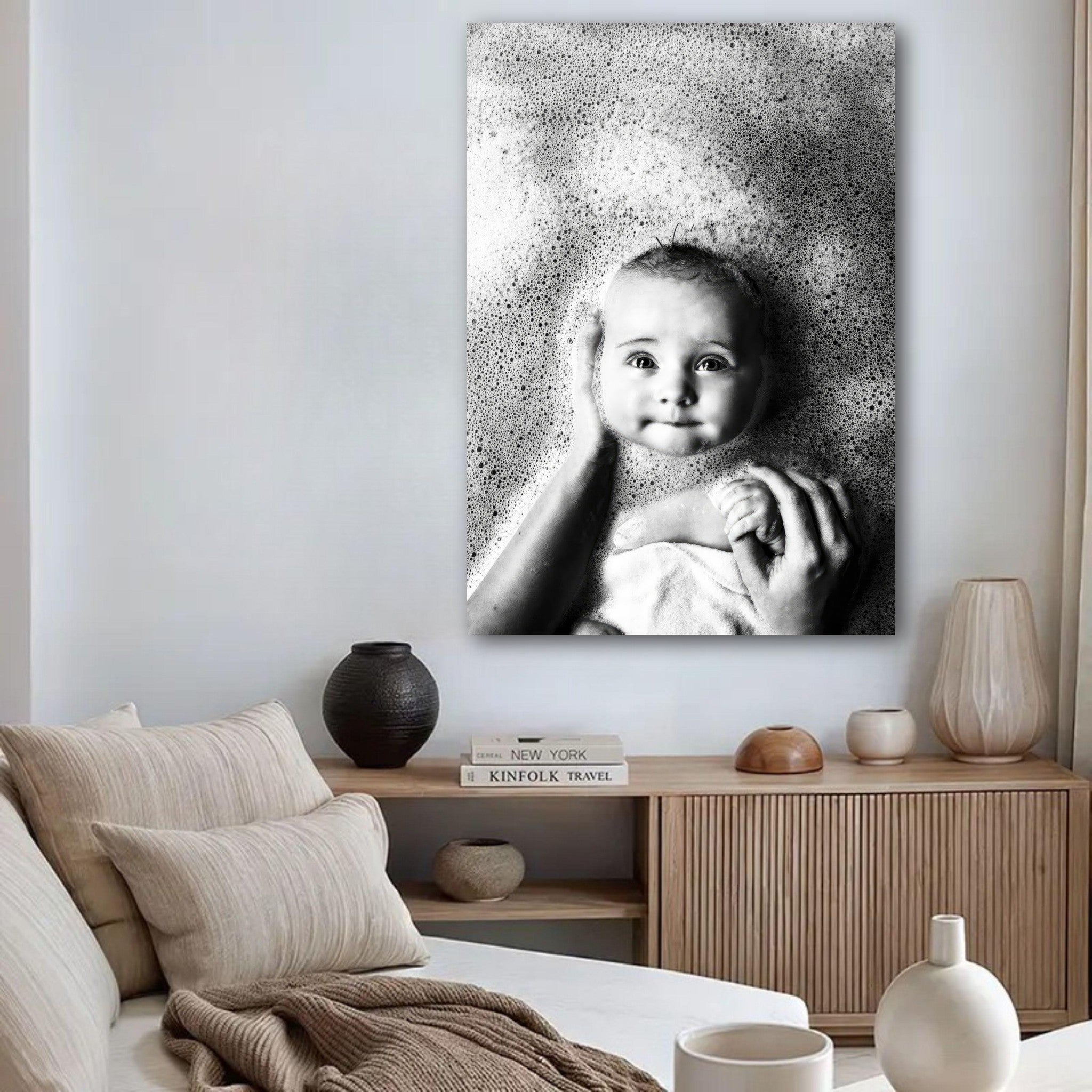 Black and white baby bath photography poster showcasing a smiling baby surrounded by soft bubbles.