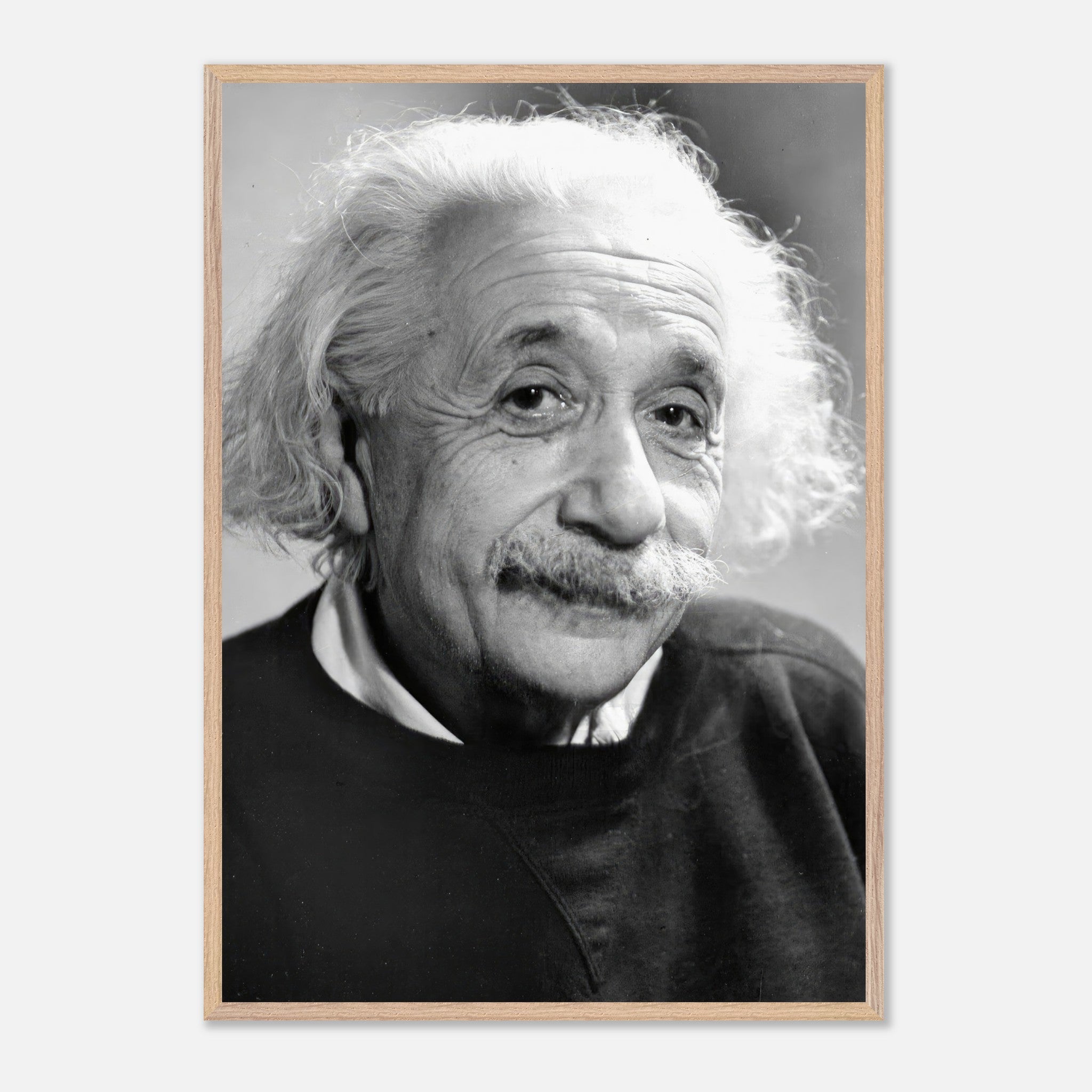 Vintage framed print of Albert Einstein in black-and-white, captured in 1946, showcasing his warm expression.