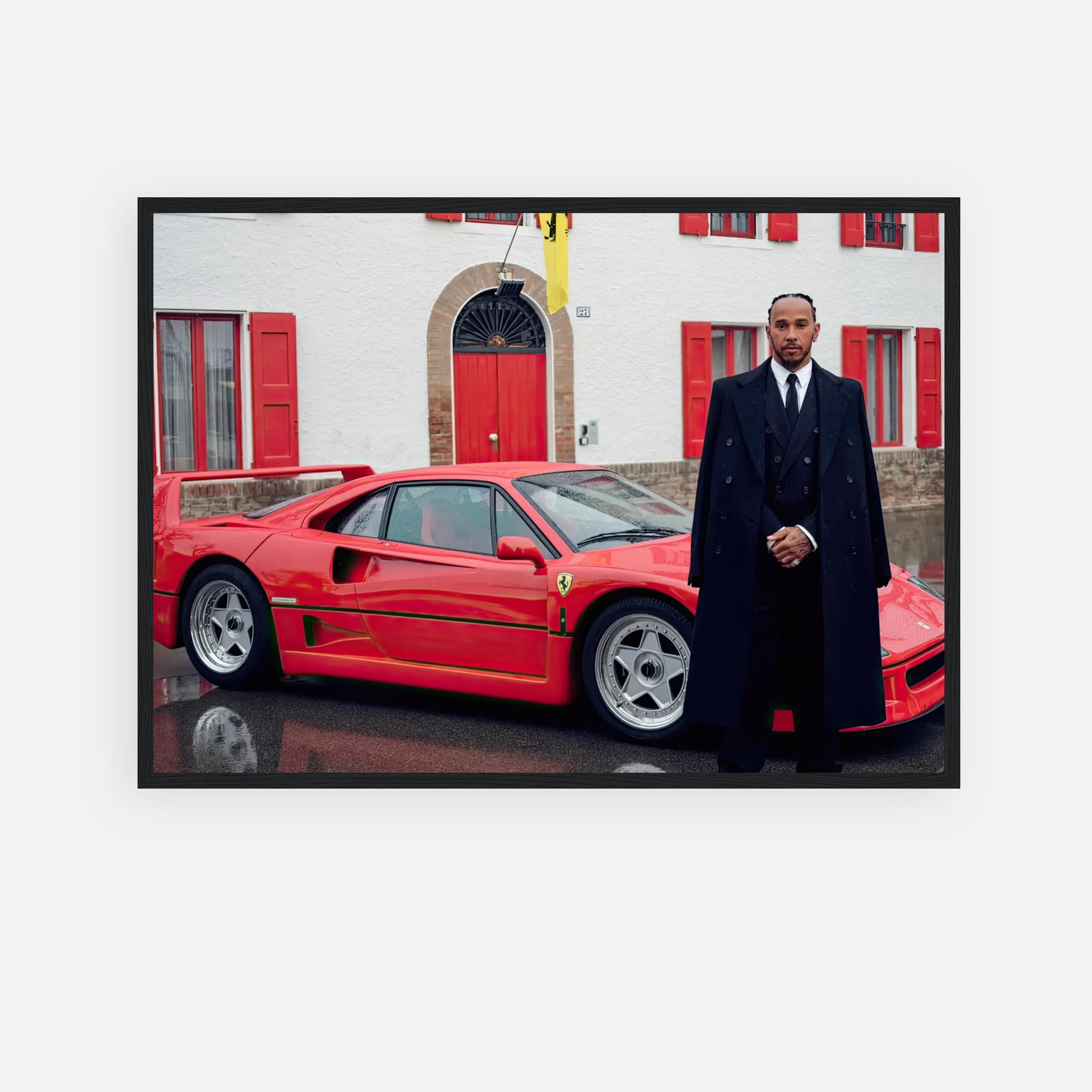 Framed print of Lewis Hamilton with Ferrari F40 in front of Enzo Ferrari's house, showcasing automotive excellence.
