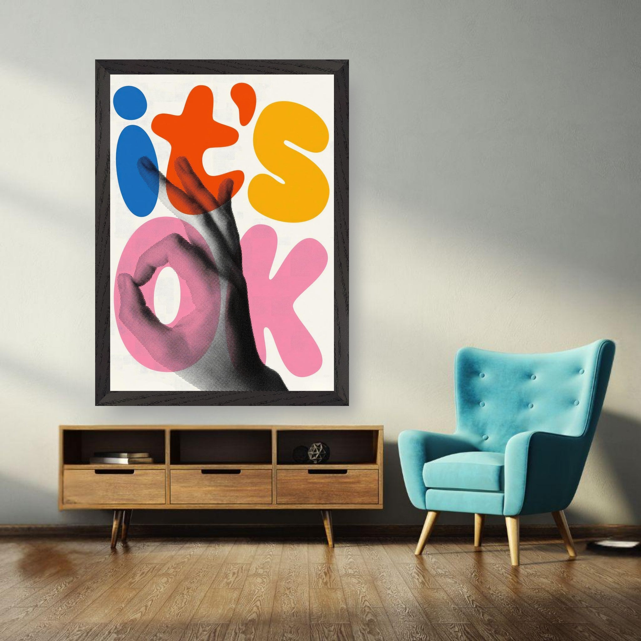 Retro abstract pop art print with 'it's OK' in vibrant colors, framed and displayed in a modern living room.