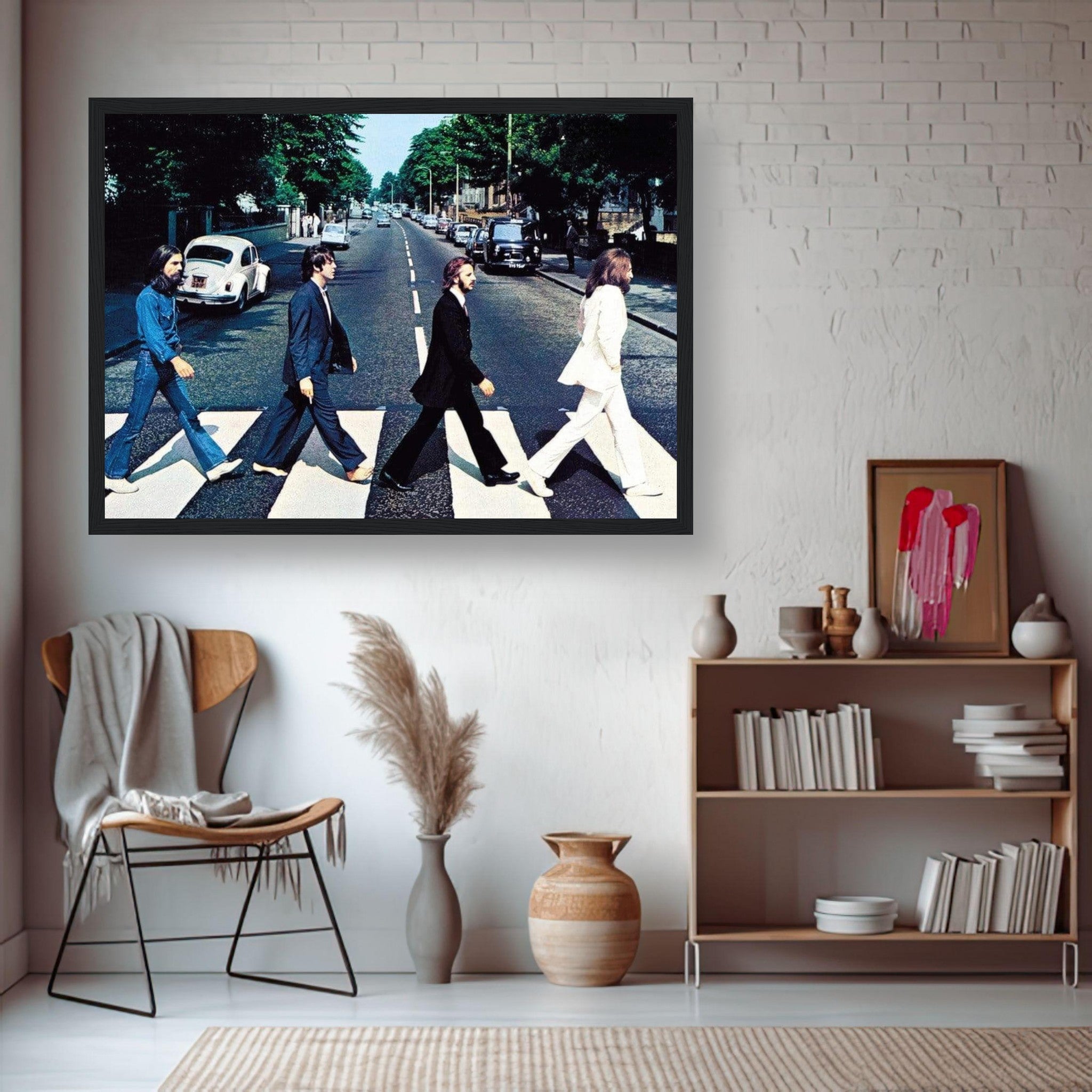 Framed print of The Beatles crossing Abbey Road, showcasing iconic album art in a stylish living room setting.