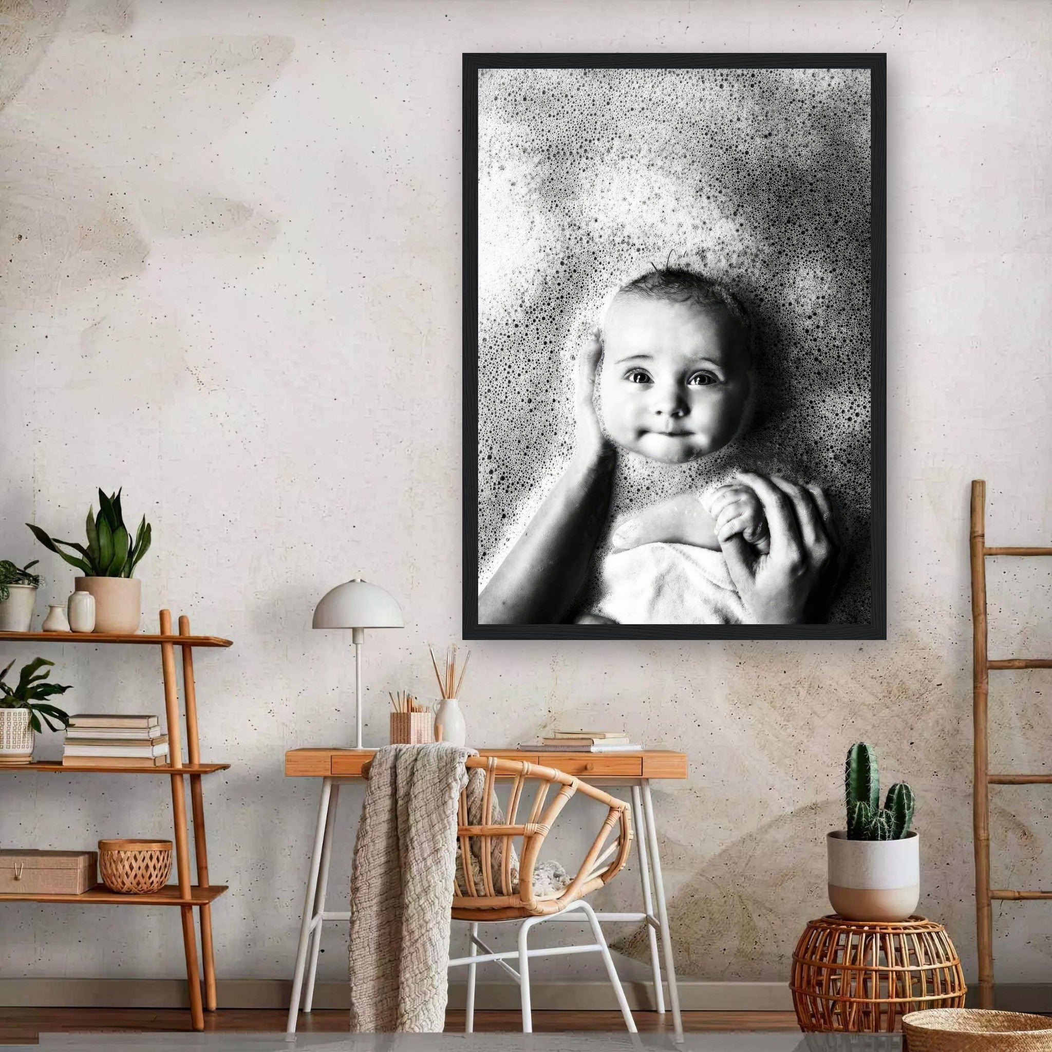 Framed print of baby bathed in bubbles, capturing joy and innocence in a timeless black-and-white photo.