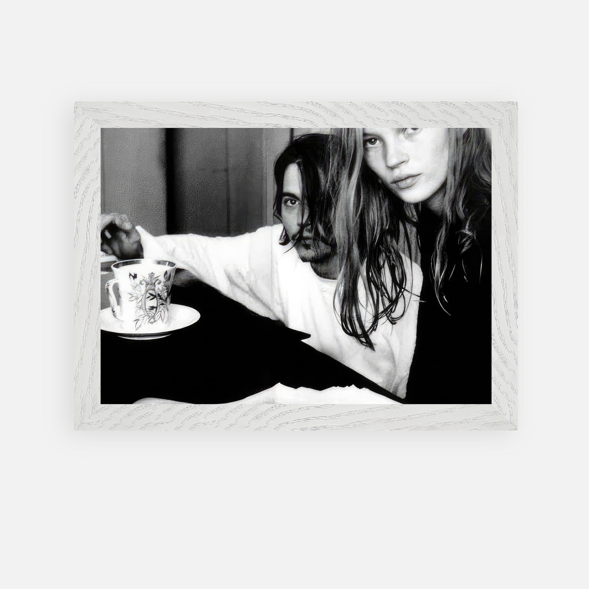 Vintage framed art of Johnny Depp and Kate Moss captured in black-and-white, embodying 90s rebellion.