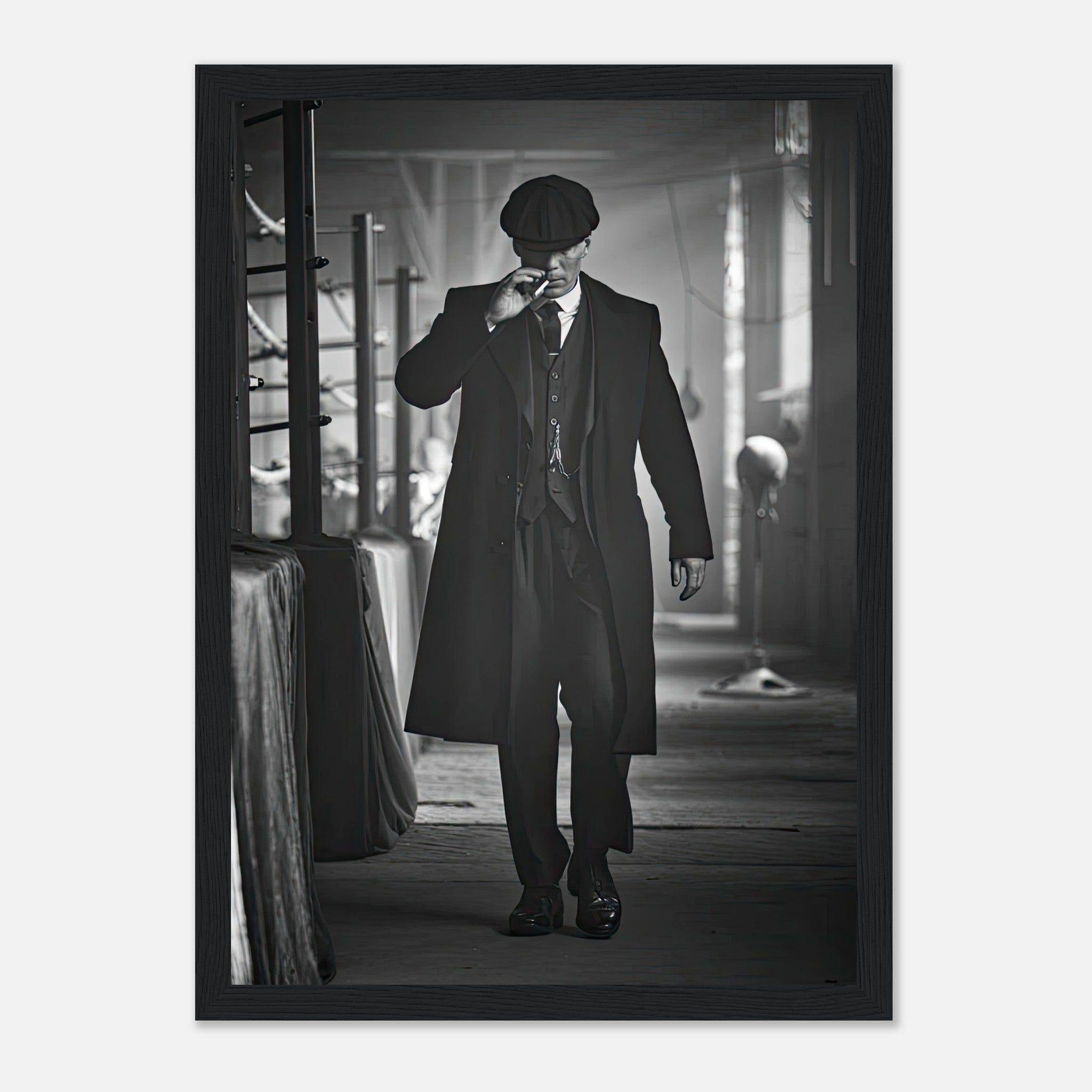 Tommy Shelby framed print from Peaky Blinders, showcasing a stylish figure in a black overcoat and flat cap.