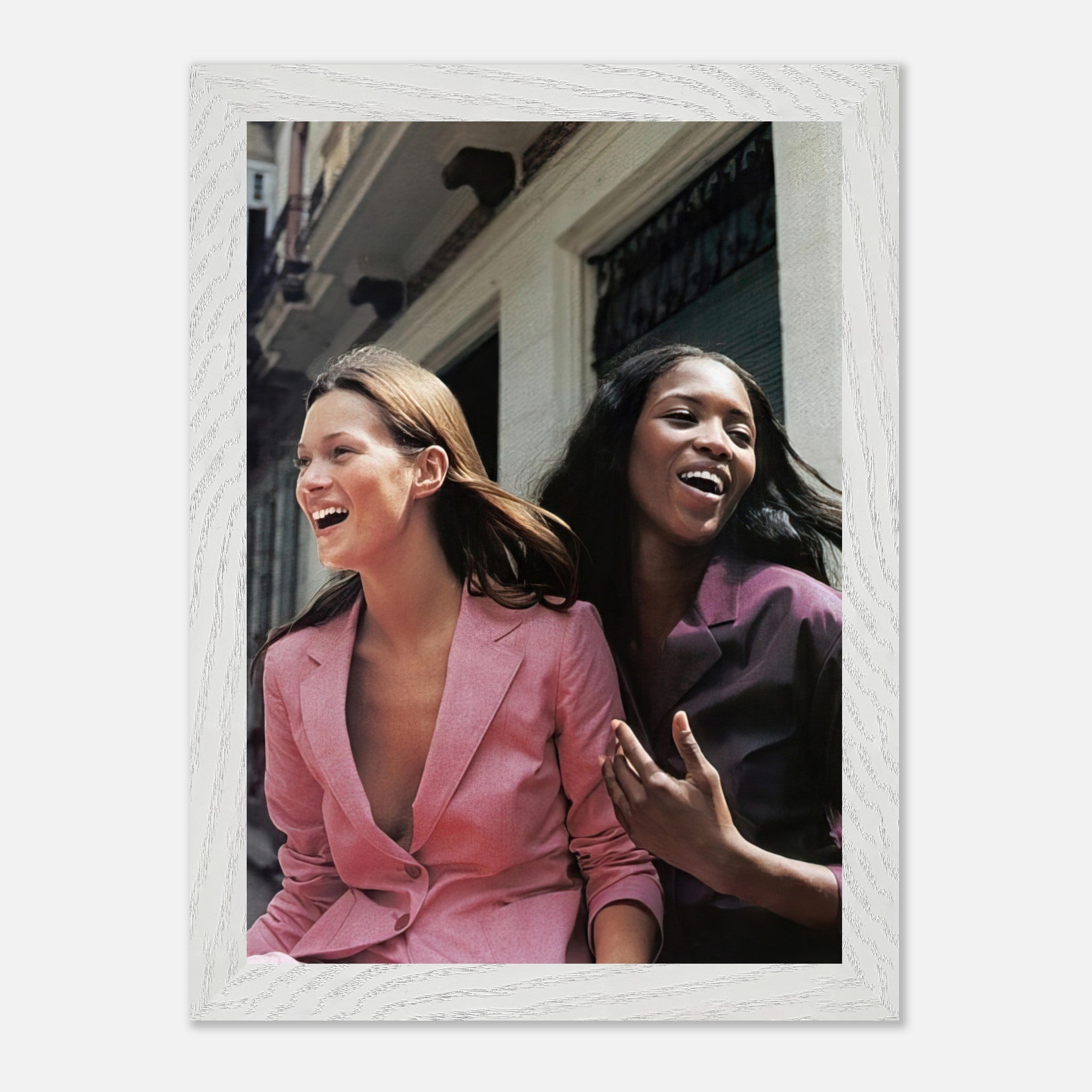 Naomi Campbell and Kate Moss laughing together in vintage fashion, framed art print showcasing iconic supermodel moment.