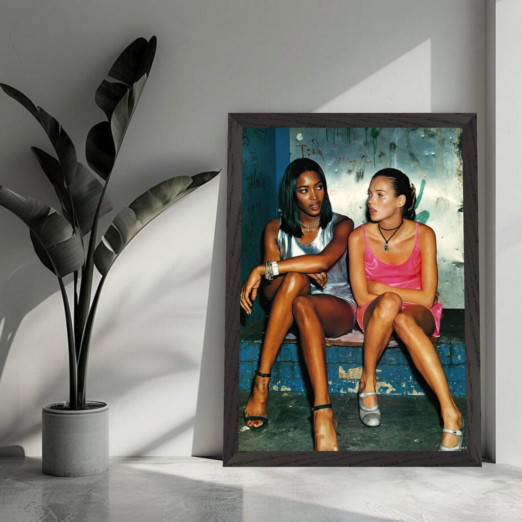 Naomi Campbell and Kate Moss vintage framed print showcasing 90s supermodel glamour and candid moments.