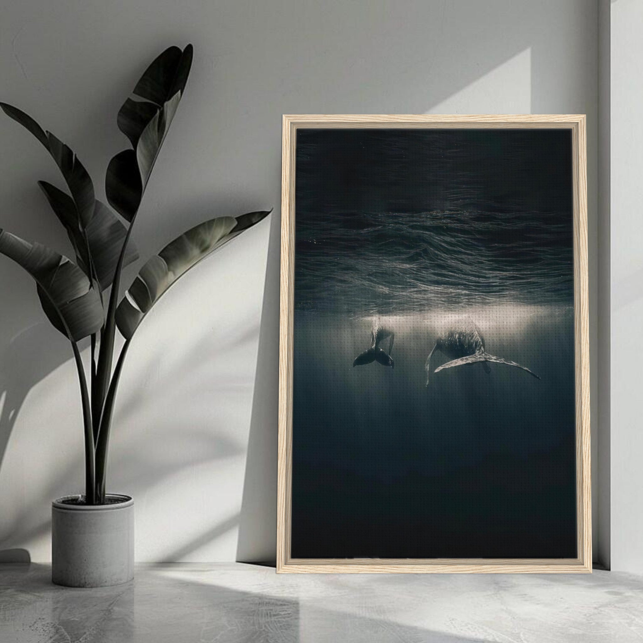 Framed canvas print of two whales swimming underwater, illuminated by sunlight in a serene ocean setting.