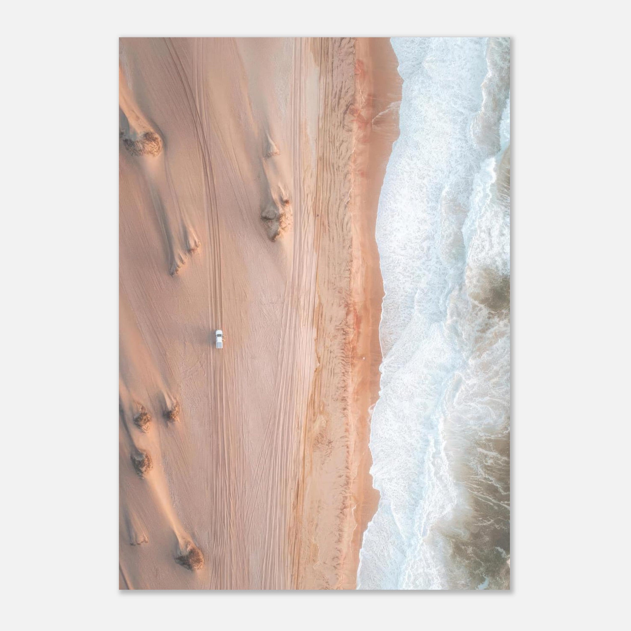 Drone photography poster showcasing golden desert dunes meeting ocean waves.
