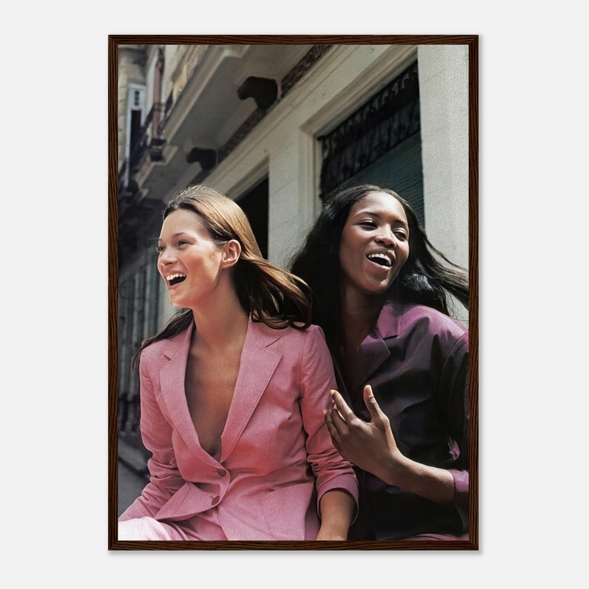 Naomi Campbell and Kate Moss framed print capturing a joyful fashion moment, showcasing elegance and style.