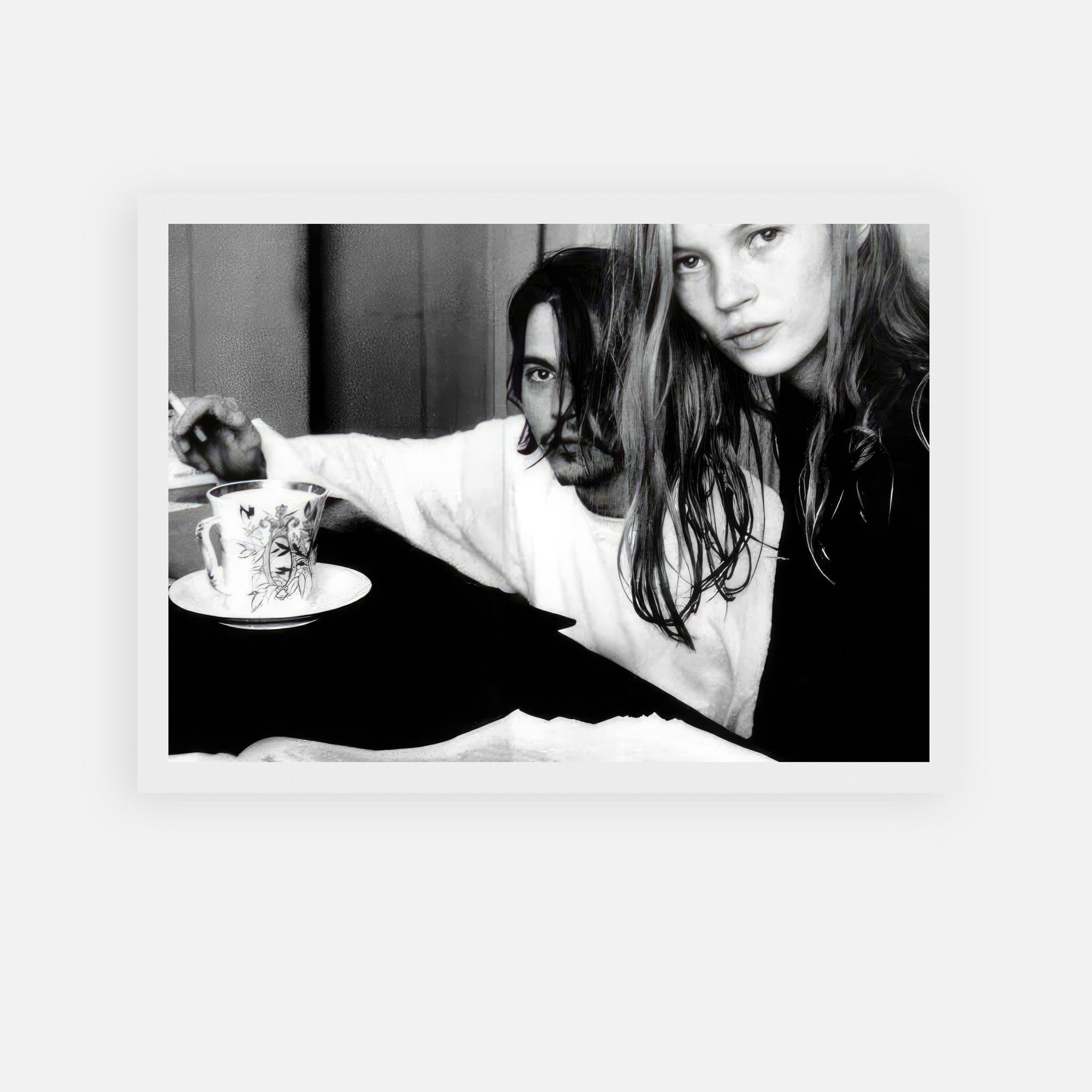 Black-and-white framed print of Johnny Depp and Kate Moss, capturing their iconic 1990s romance.