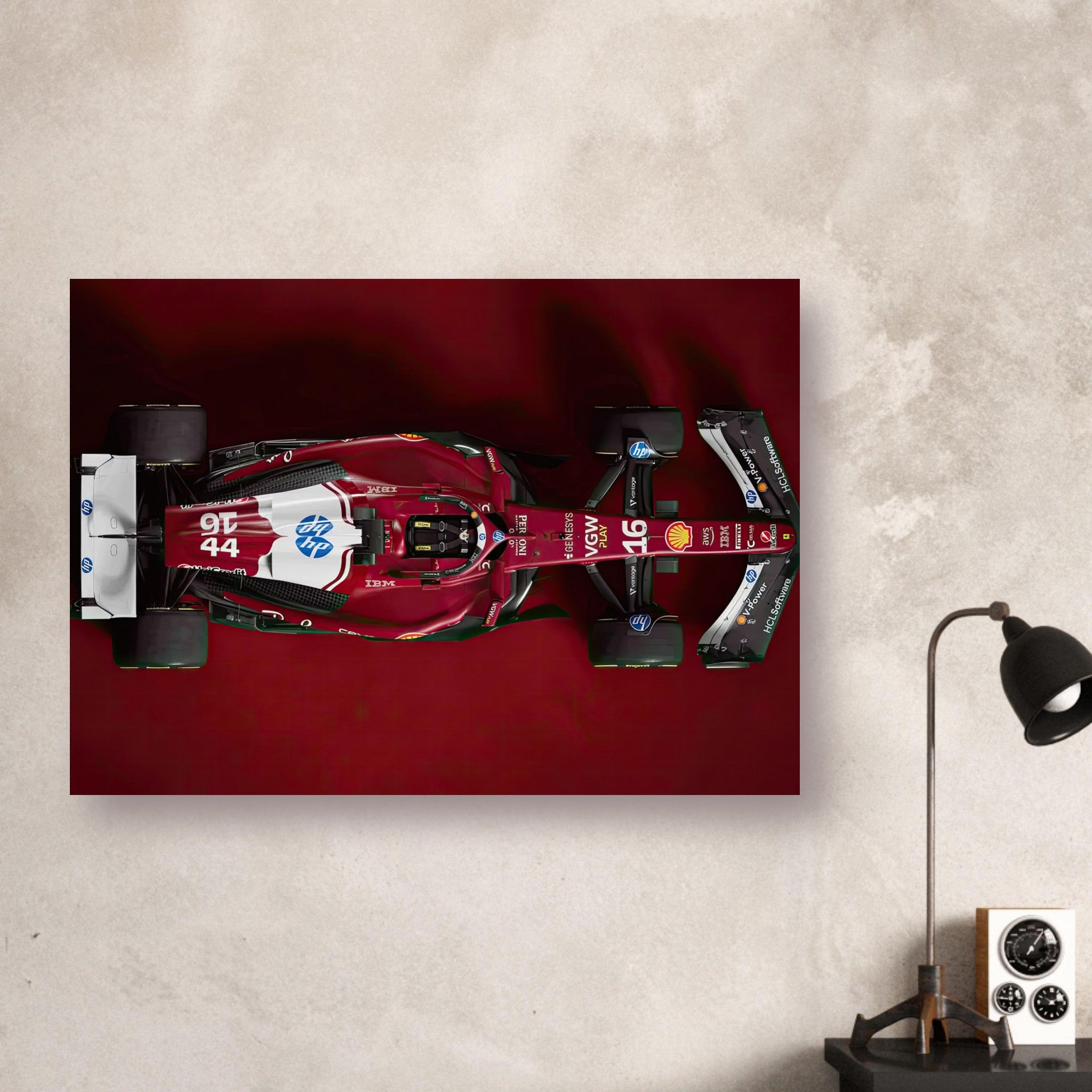 Ferrari F1 2025 poster showcasing top-down view of sleek race car design and vibrant sponsor livery.