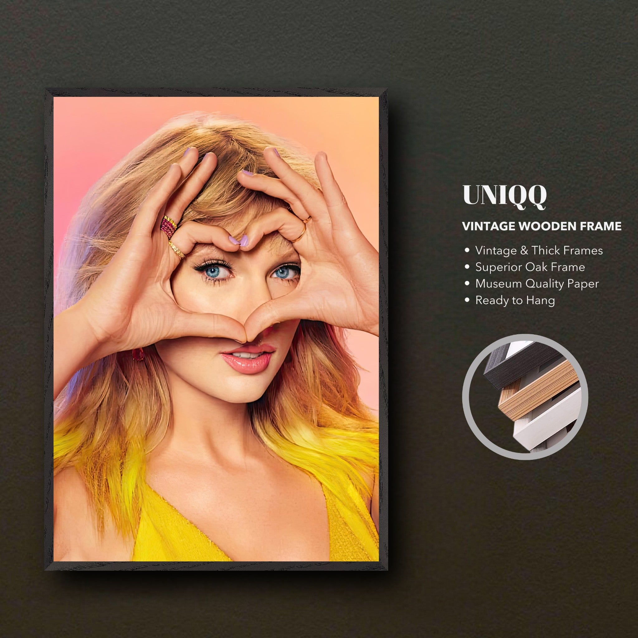 Vintage framed print of Taylor Swift making a heart shape with her hands, showcasing vibrant colors and a stylish Black frame.