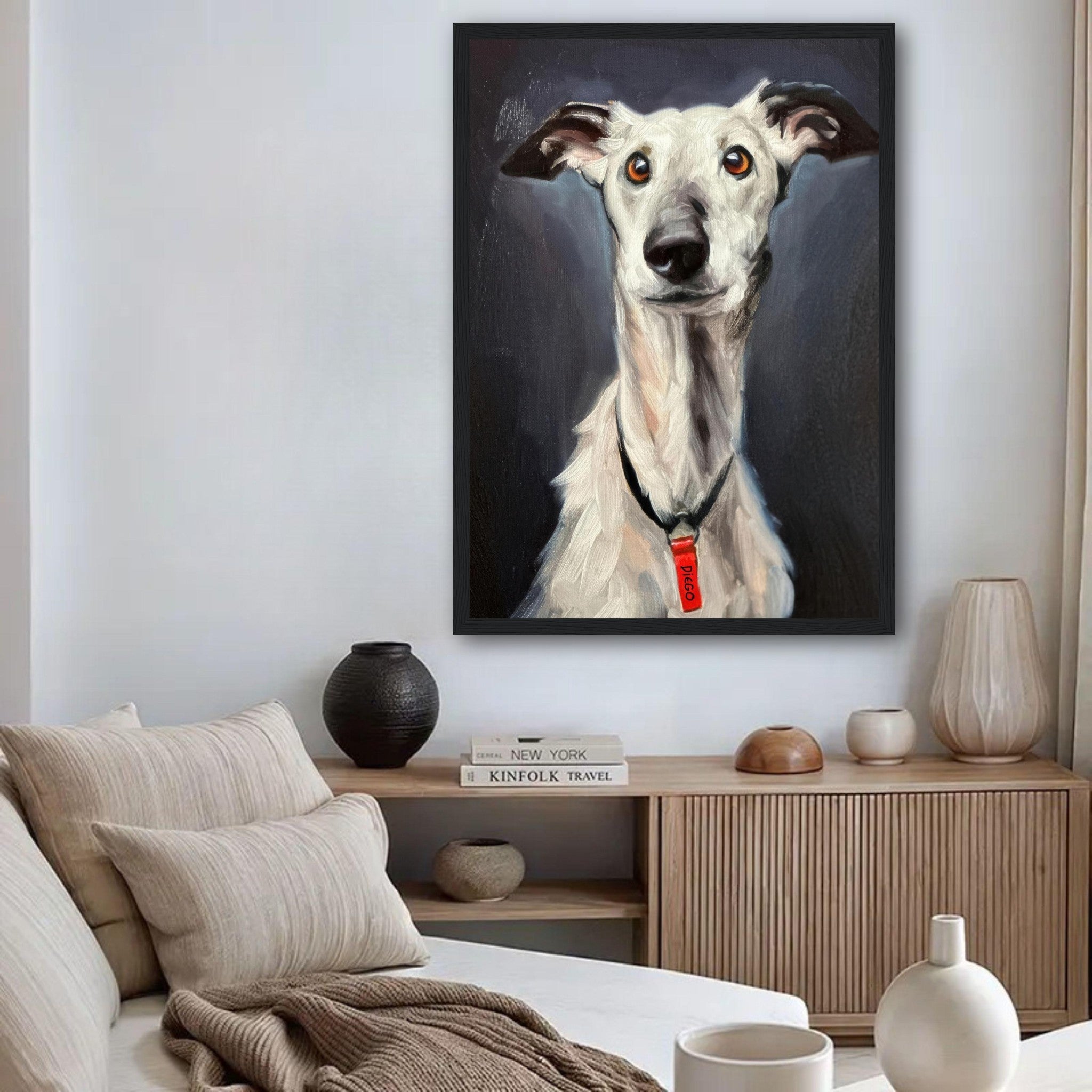 Framed print of a greyhound dog painting, showcasing its soulful expression in a stylish living room setting.