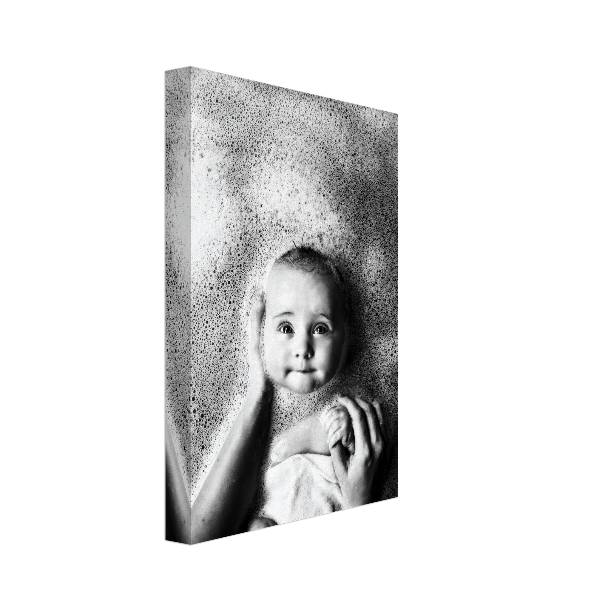 Black-and-white canvas print of a baby's joyful expression surrounded by bath bubbles