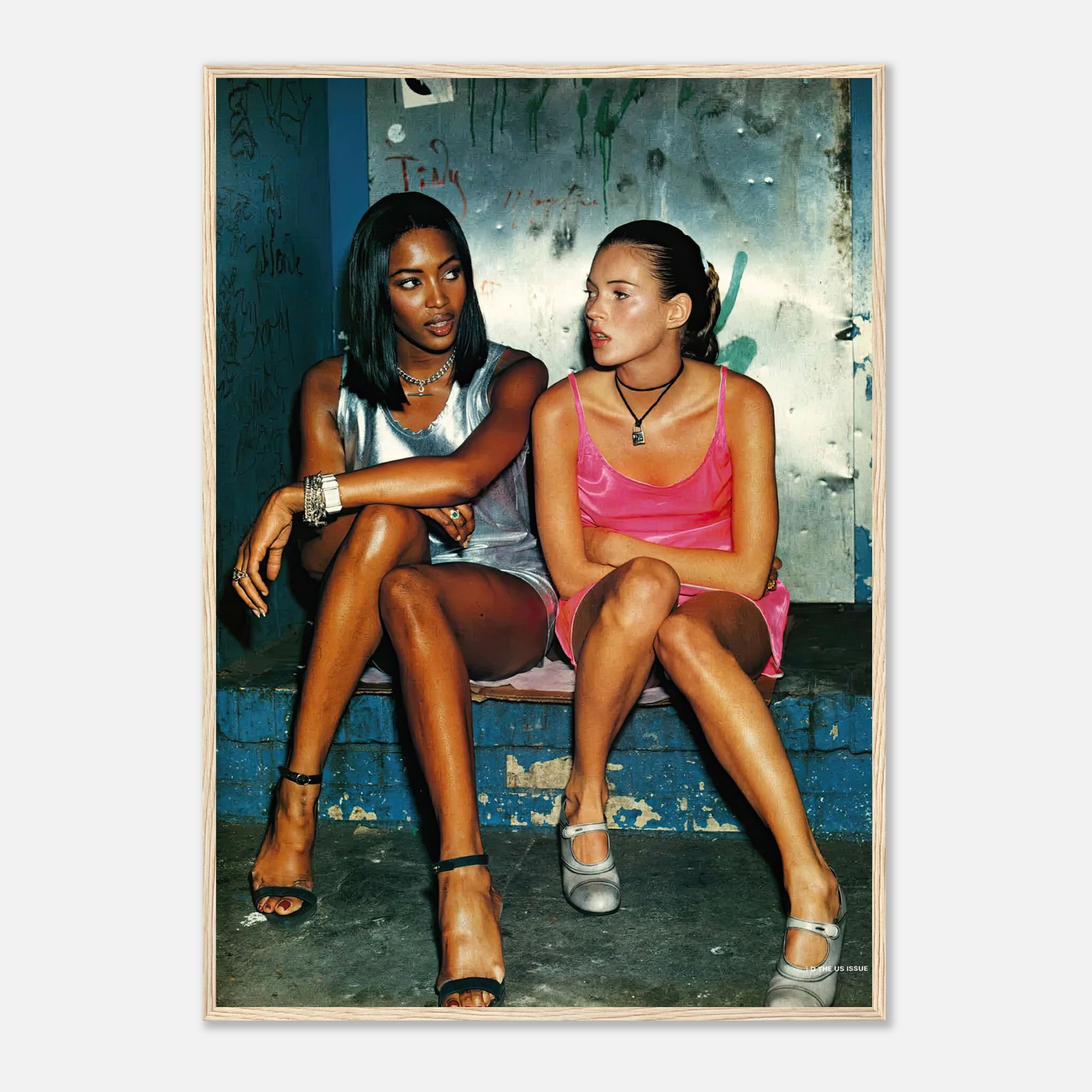 Naomi Campbell and Kate Moss framed print showcasing 90s fashion icons in a candid moment.