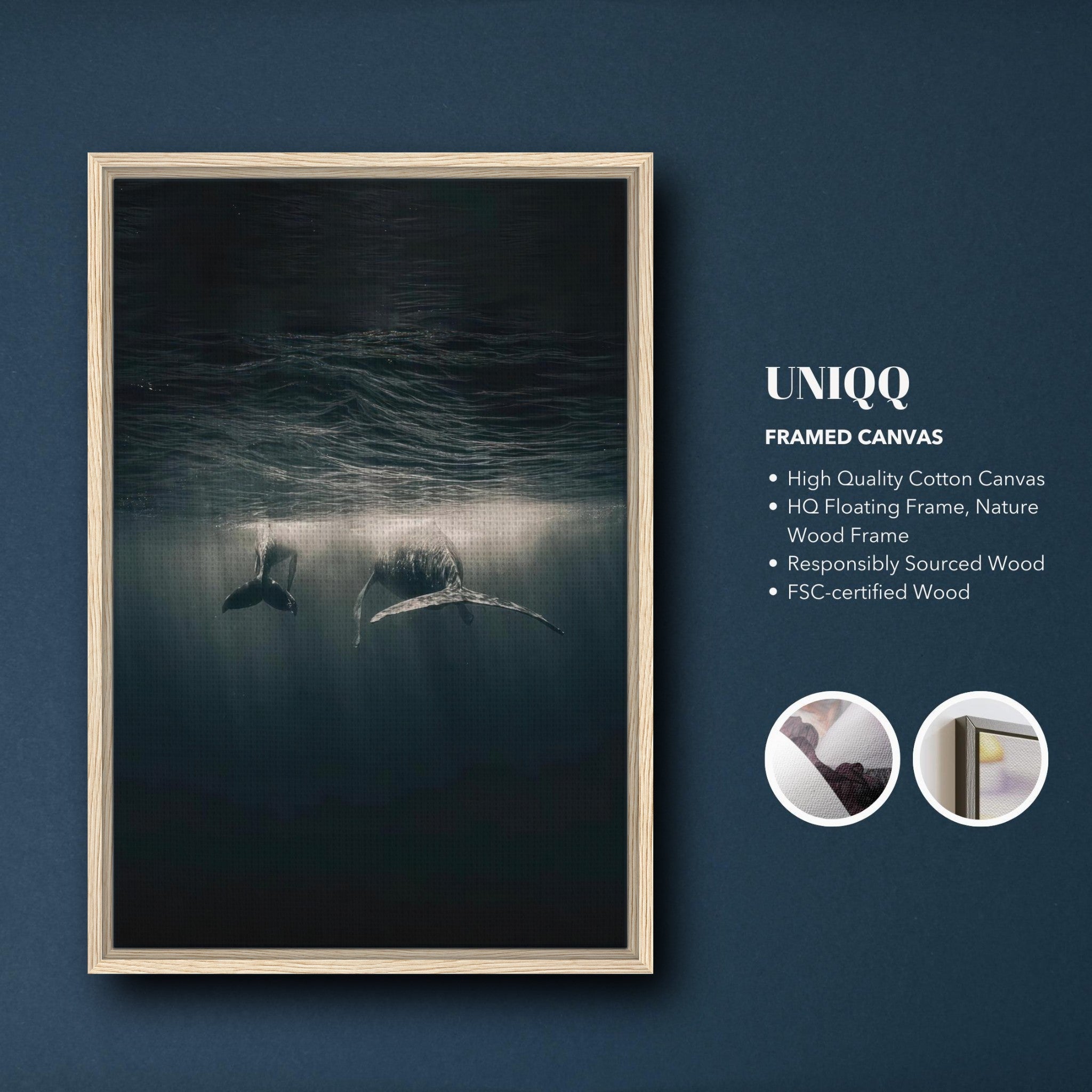 Whales gliding underwater depicted in a framed canvas print, showcasing elegance and serenity of ocean life.