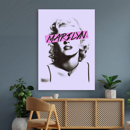 Marilyn Monroe poster featuring a black-and-white portrait with vibrant pink text, adding modern flair to home decor.