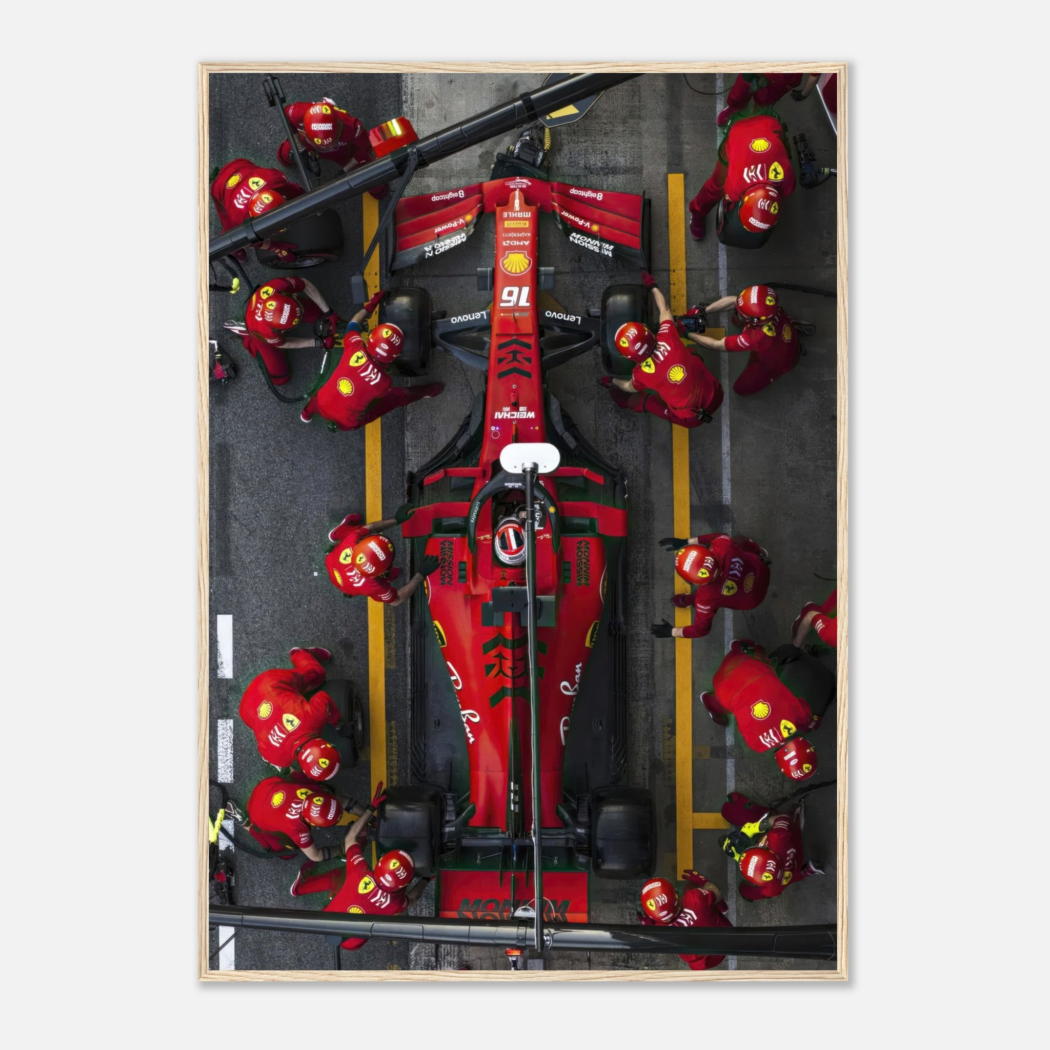 Formula 1 Ferrari pitstop framed print showcasing intense action and precision of the pit crew in vibrant red colors.