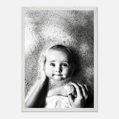 Vintage black and white baby bath photography with bubbles, showcasing a smiling infant in serene ambiance.