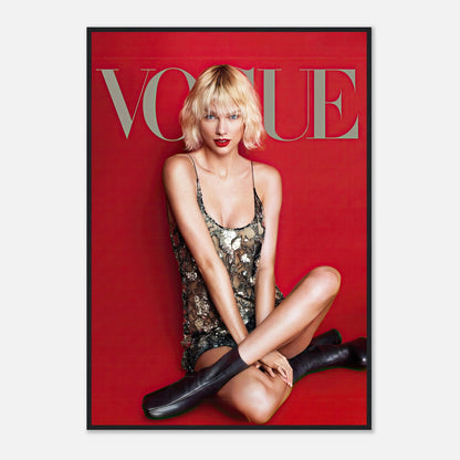 Taylor Swift posing in a metallic dress on the Vogue cover, framed poster with a vibrant red backdrop.