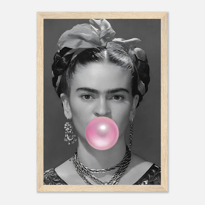 Frida Kahlo framed print featuring a black and white portrait with pink bubble gum, adding a whimsical touch to decor.