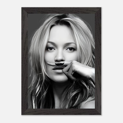 Vintage framed print of Kate Moss holding a playful mustache, blending high fashion with humor in black and white.