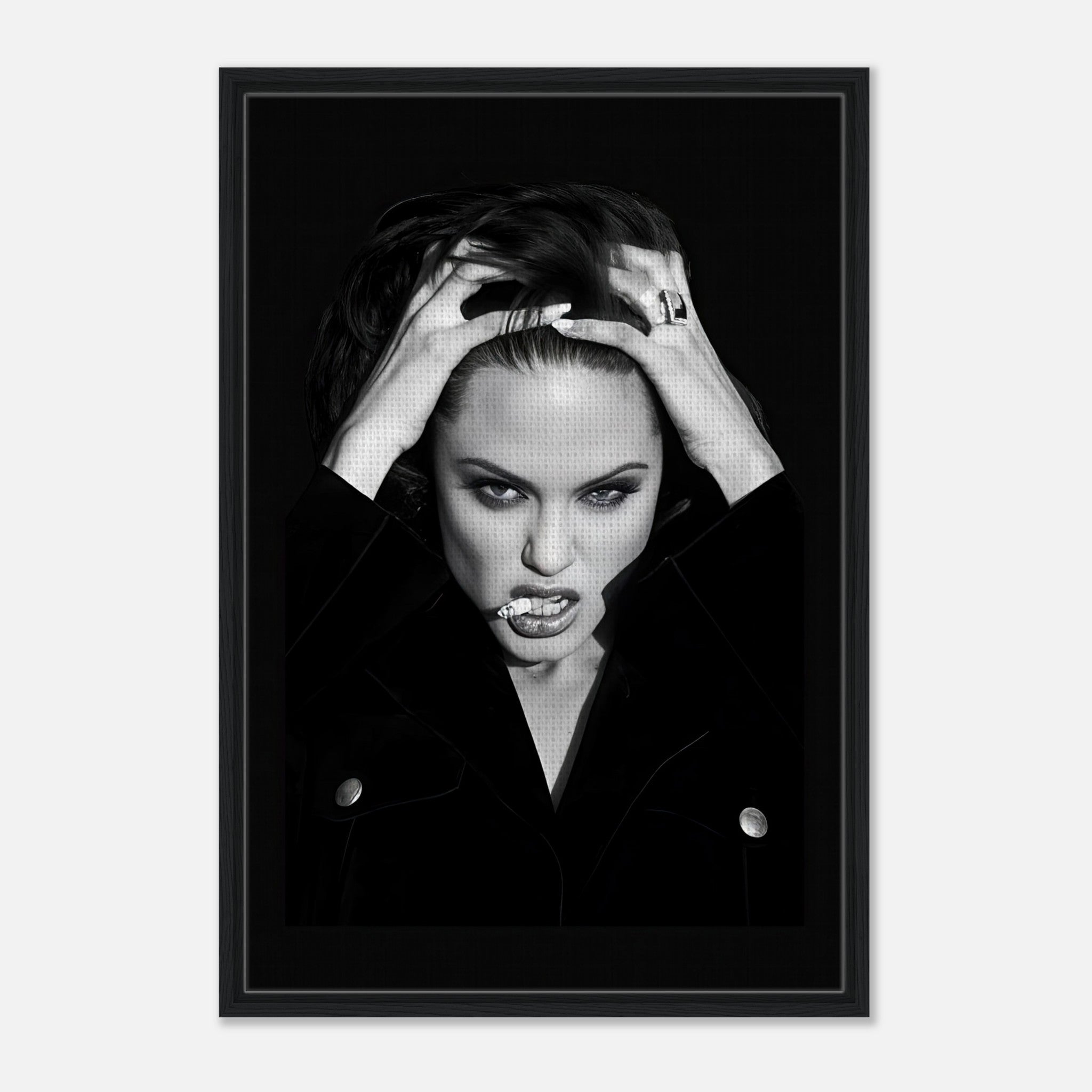 Angelina Jolie framed canvas print showcasing her fierce expression and bold style, perfect for home or office decor.