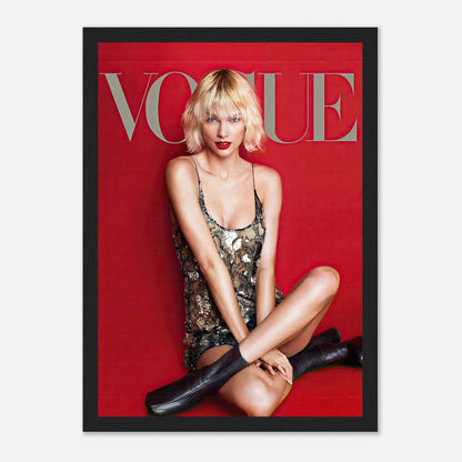 Taylor Swift Vogue framed poster, featuring her in a metallic dress against a striking red background. Perfect for fans and collectors.