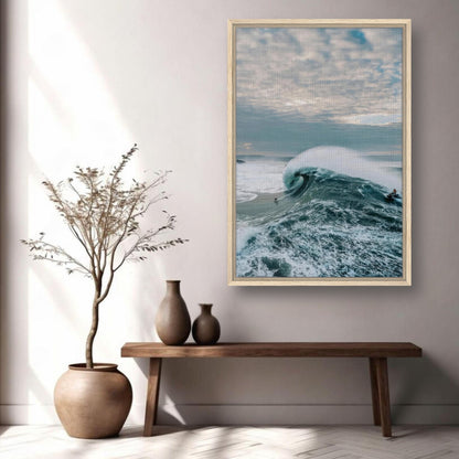 Big Wave Surfing Framed Canvas Print showcasing a surfer riding a massive wave in a stylish interior setting.