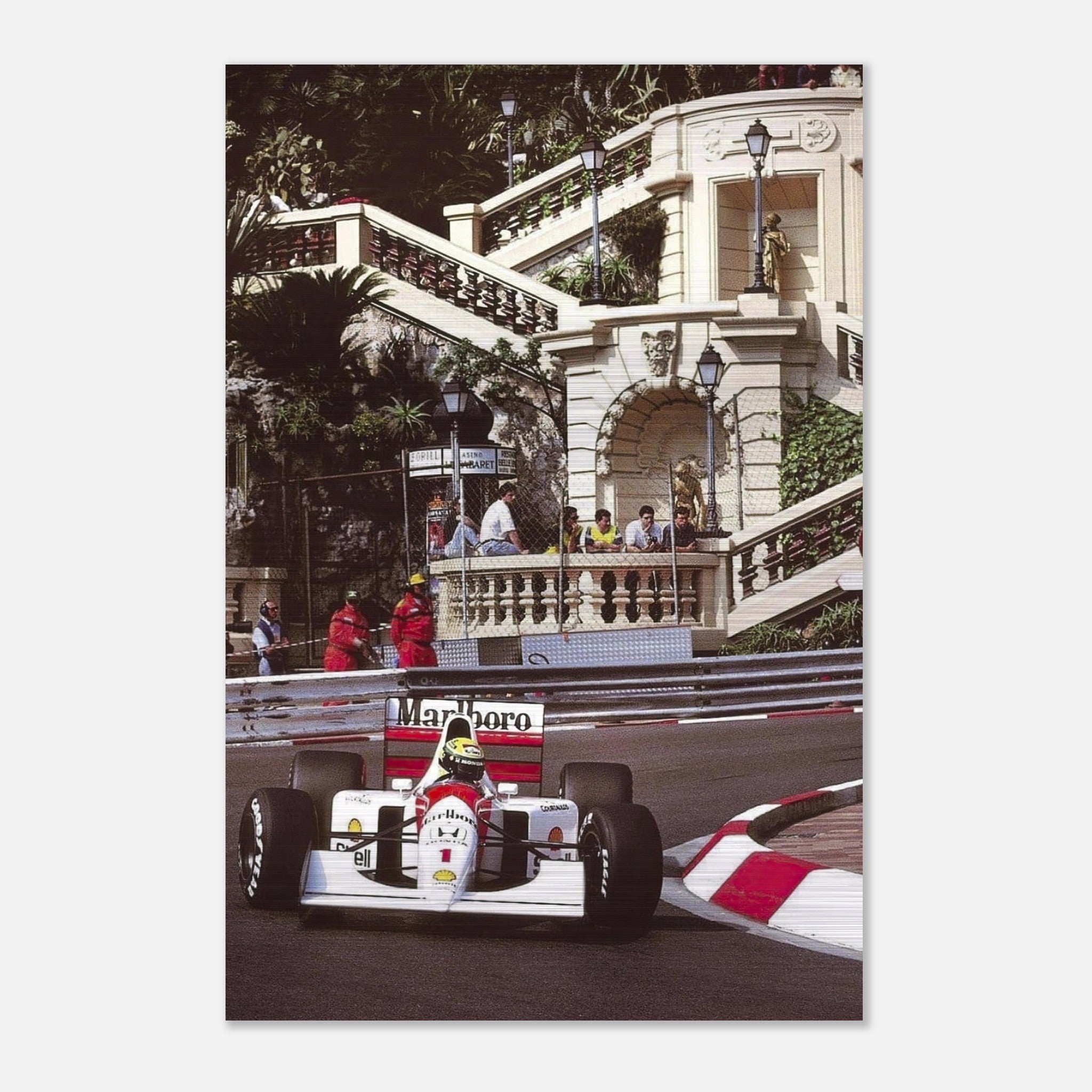 Ayrton Senna racing at Monaco, captured in a brushed metal print highlighting motorsport art and industrial style.