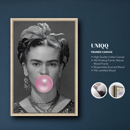 Frida Kahlo Bubble Gum framed canvas print featuring grayscale artwork and a pink bubble, set in a natural wood frame.