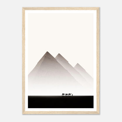 Framed print of the Pyramids of Giza with silhouettes of camels in the desert, capturing Egypt's majestic landscapes.