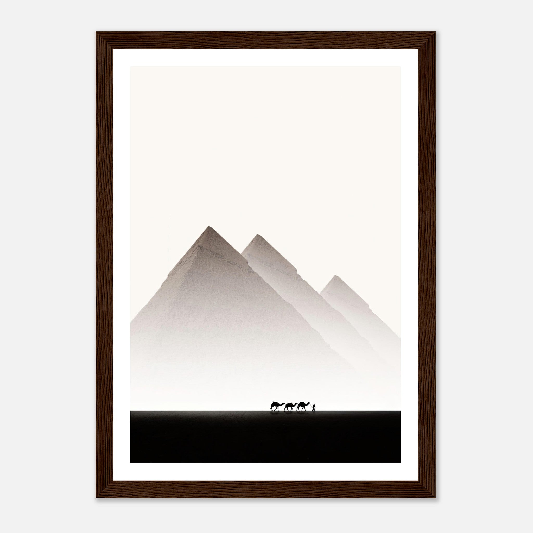 Pyramids of Giza framed print depicting majestic pyramids and silhouettes of camels in desert landscape.