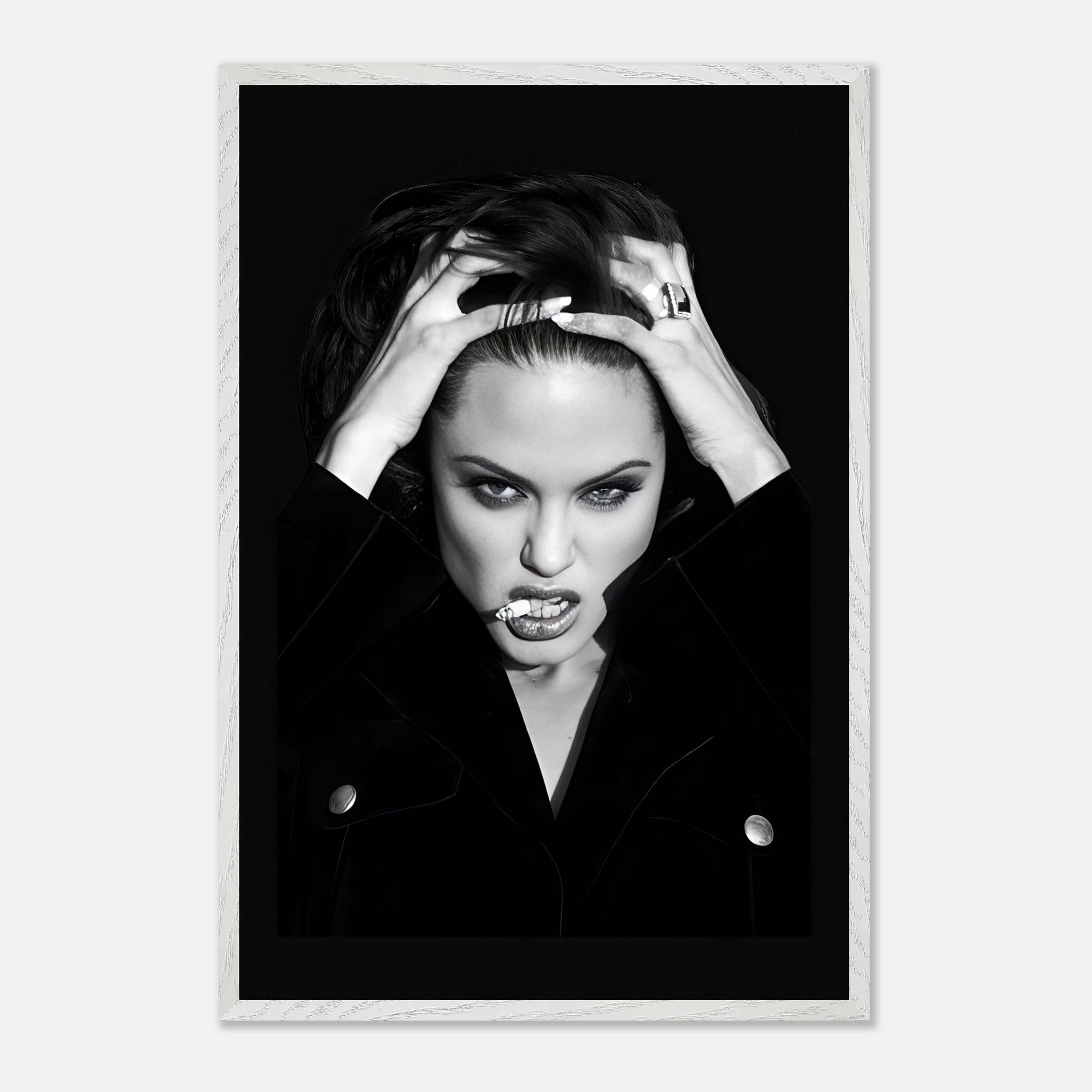 Angelina Jolie vintage framed print showcasing her bold attitude and glamour in a striking black-and-white photograph.