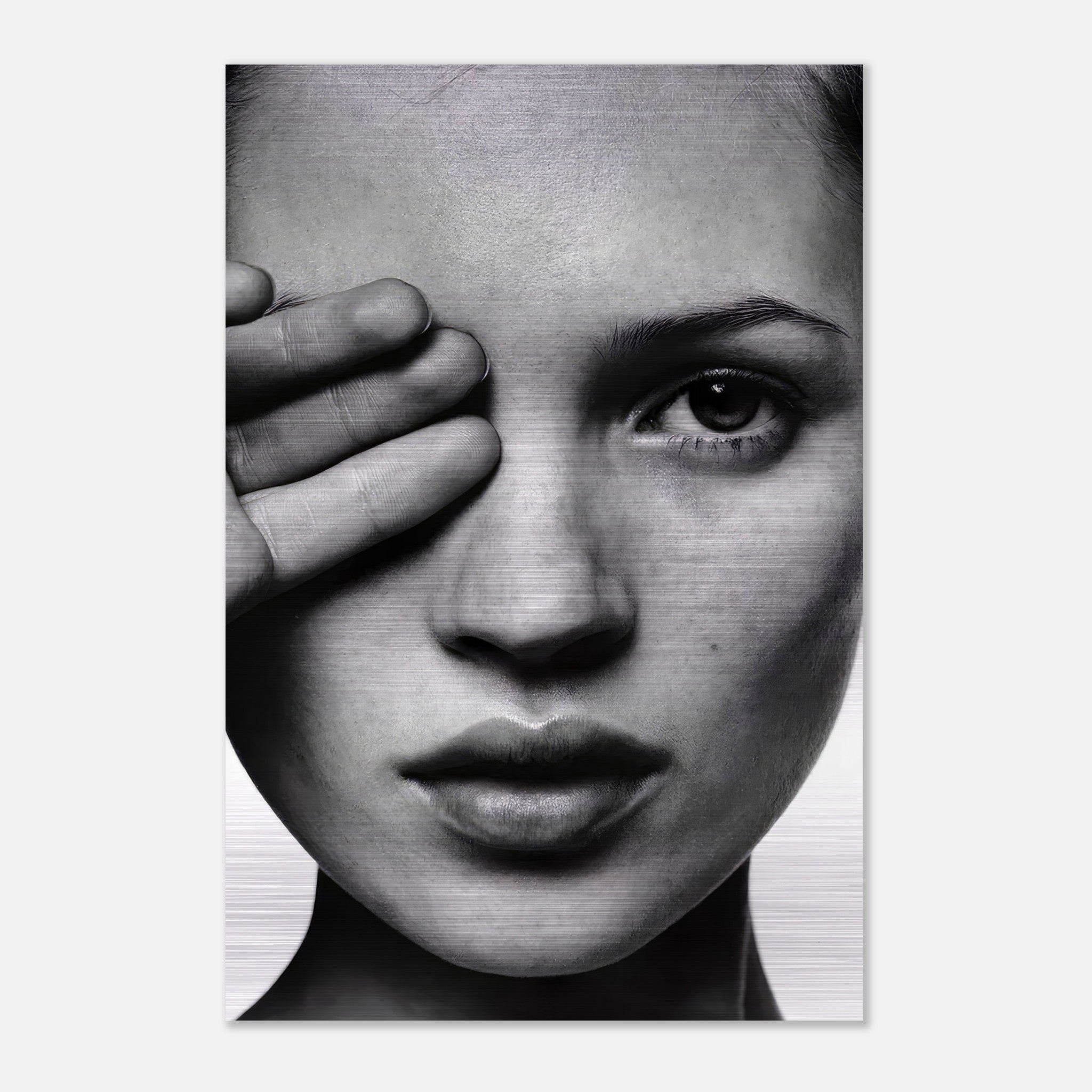 Striking black and white portrait of Kate Moss on brushed metal, highlighting her timeless beauty and modern aesthetic.