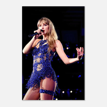 Taylor Swift performing in a dazzling blue outfit on stage, captured in a vibrant metal print for fans.