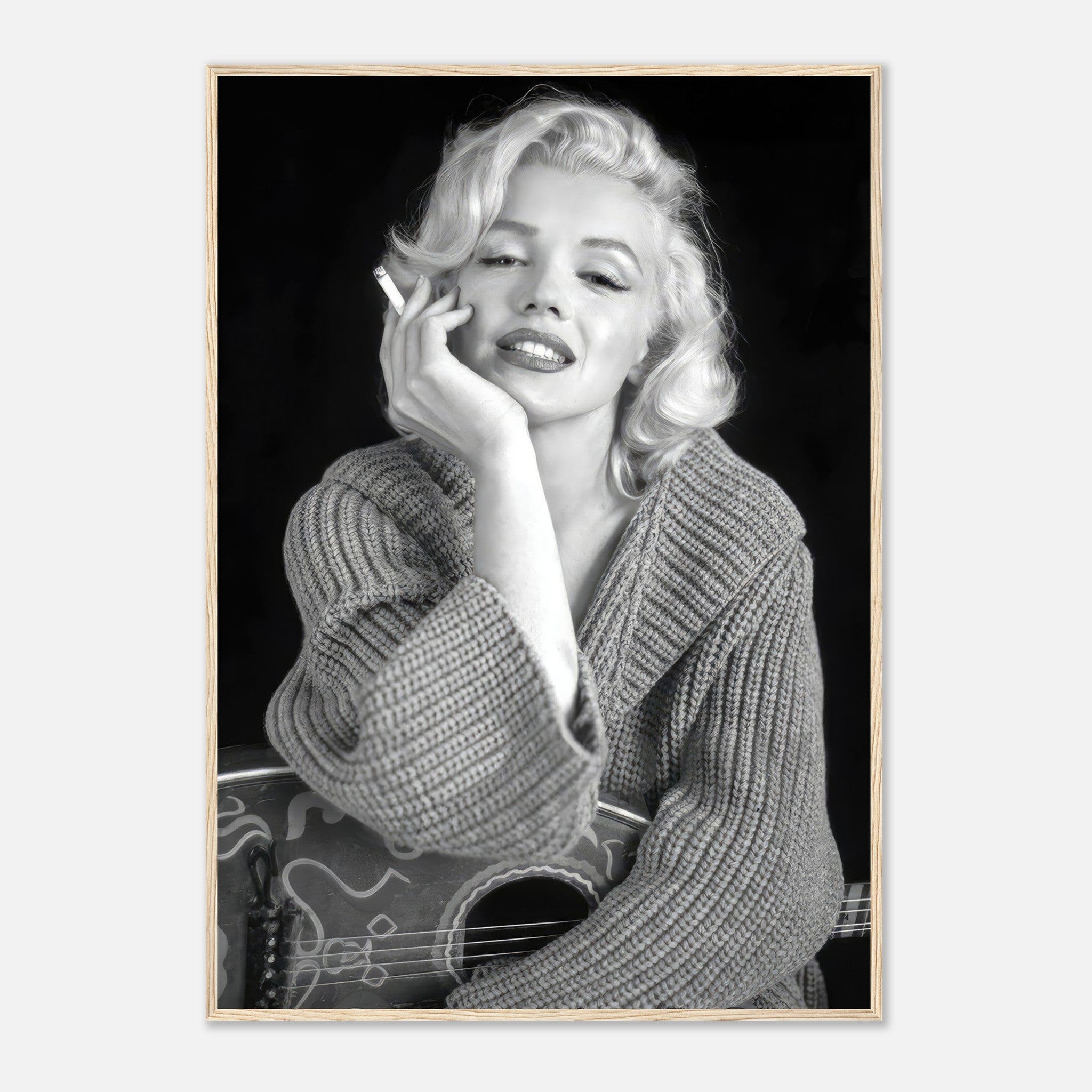 Marilyn Monroe smoking with guitar in black-and-white framed poster, showcasing timeless elegance and iconic Hollywood style.