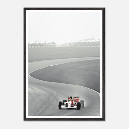 Framed Giclée fine art print of Ayrton Senna racing in McLaren MP4/4 on track, capturing speed and precision.