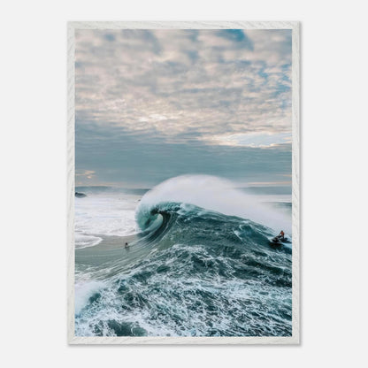 Big Wave Surfing Vintage Framed Print featuring a surfer riding a massive wave against a dramatic sky.
