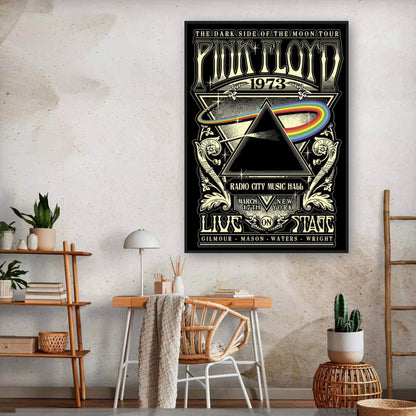 Framed print of Pink Floyd's "The Dark Side of the Moon" 1973 tour poster displayed in a modern room setting.