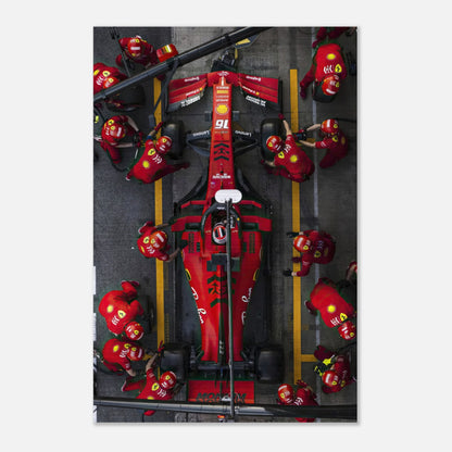 Brushed metal print of a Ferrari pitstop, showcasing dynamic Formula 1 racing with vibrant colors and intricate details.